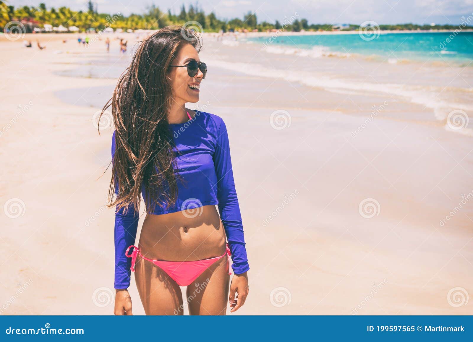https://thumbs.dreamstime.com/z/beach-rashguard-bikini-woman-wearing-swim-shirt-rash-guard-sun-protection-against-solar-uv-rays-beach-rashguard-bikini-woman-199597565.jpg