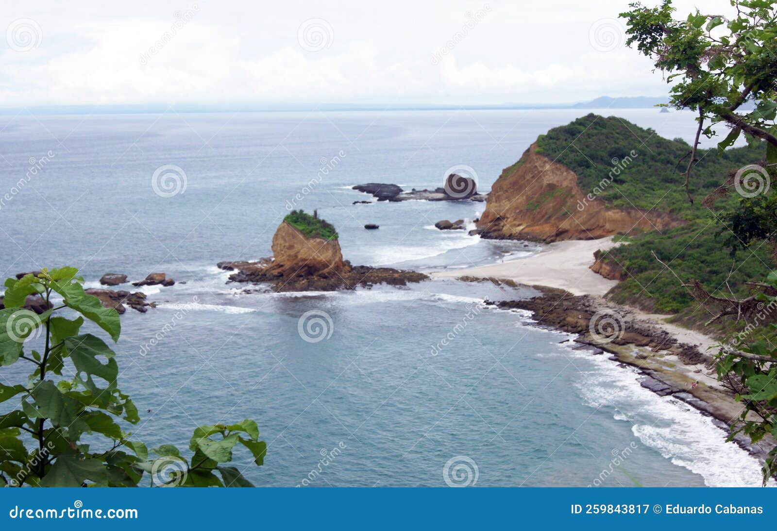 beach and rock in machalilla national park - puerto lopez - ecuador