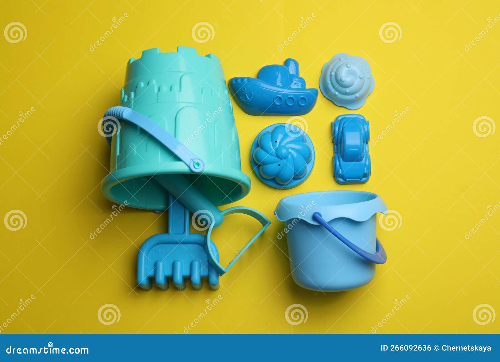 Beach Sand Toy Kit on Yellow Background, Flat Lay Stock Photo Image