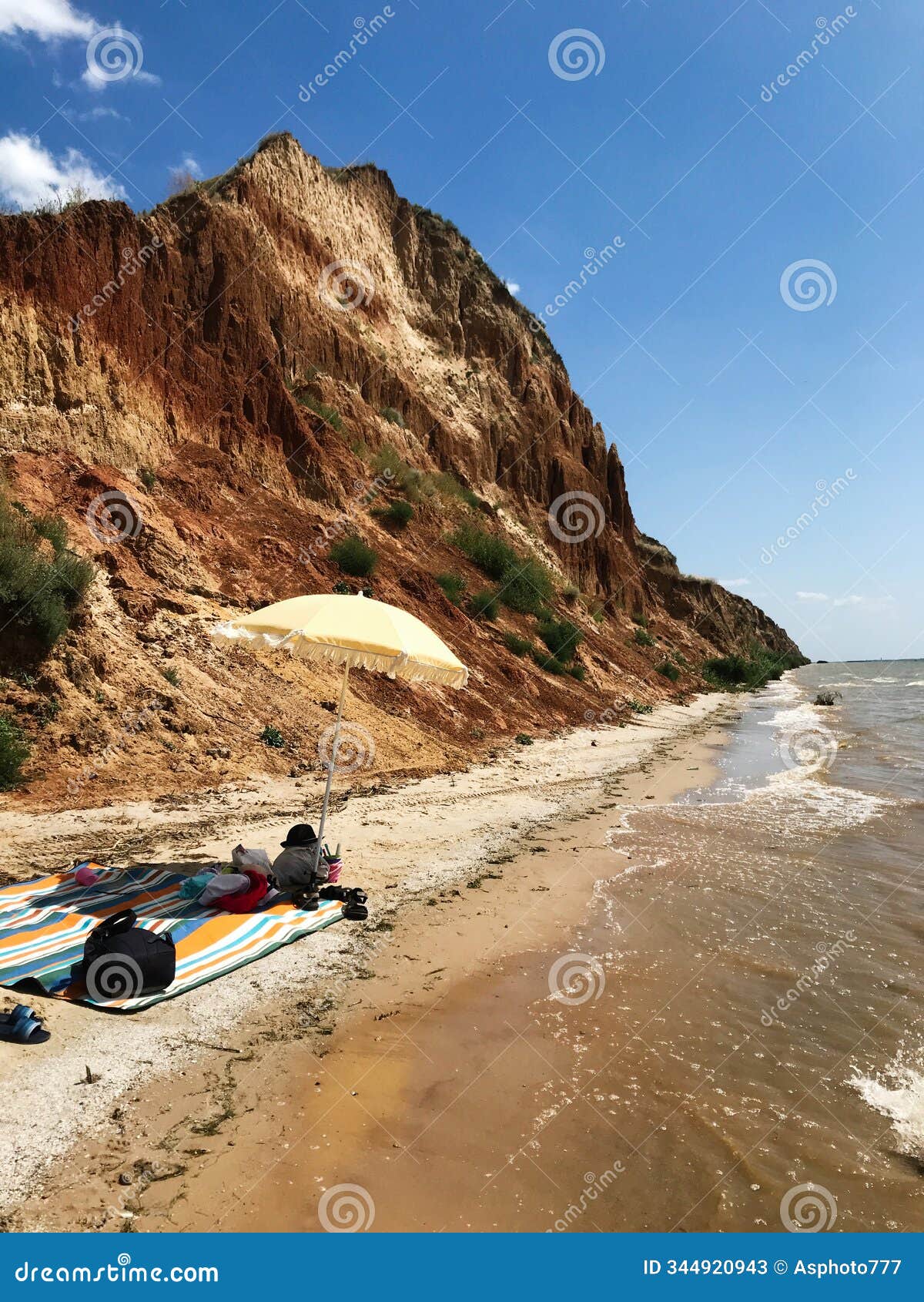 relaxing beach day with waves and golden cliffs under sunny skies. grand canyon stanislav, ukraine