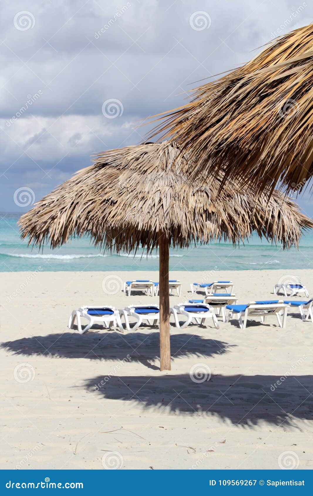 Beach Umbrella and Emerald Water Background Stock Image Image of
