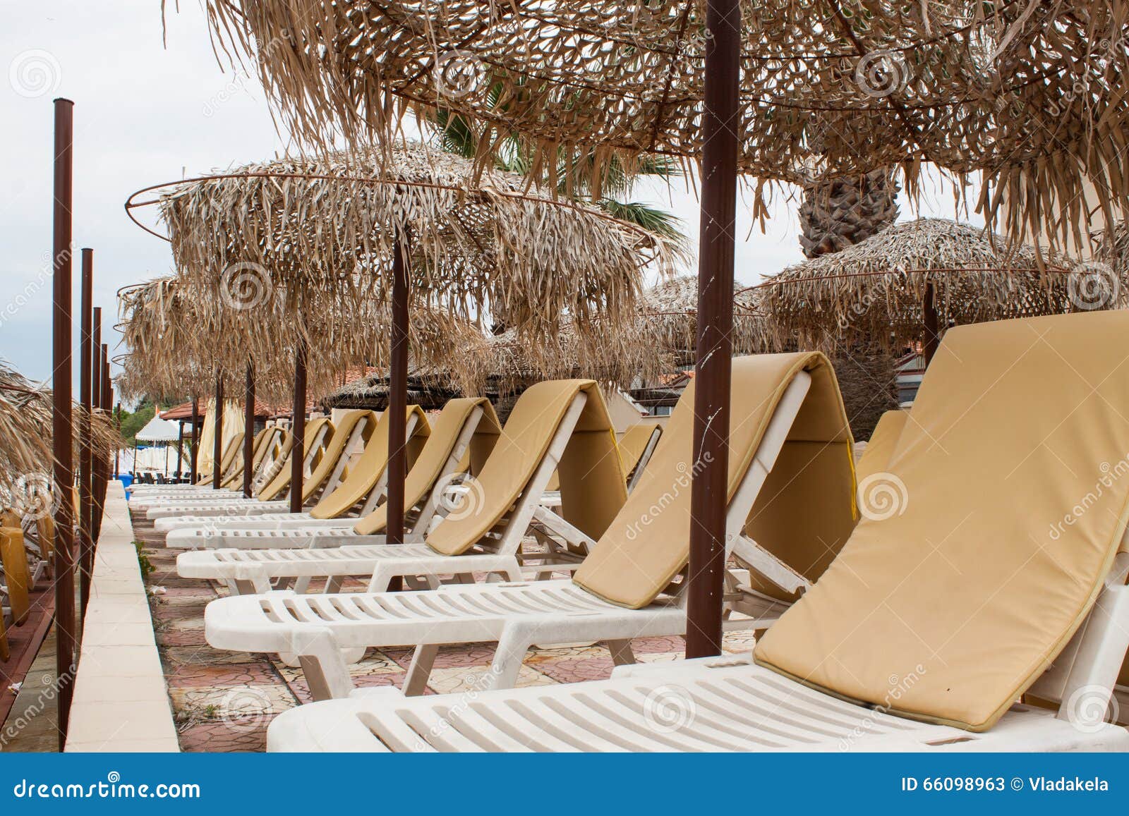 Beach Umbrella and Plastic Deck Chairs on the Beach,Greek , Pefkohori