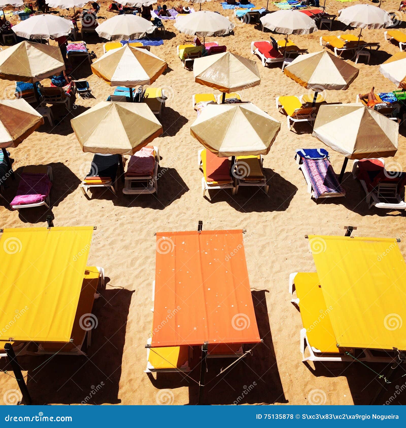 Beach umbrellas stock photo. Image of umbrellas, algarve 75135878