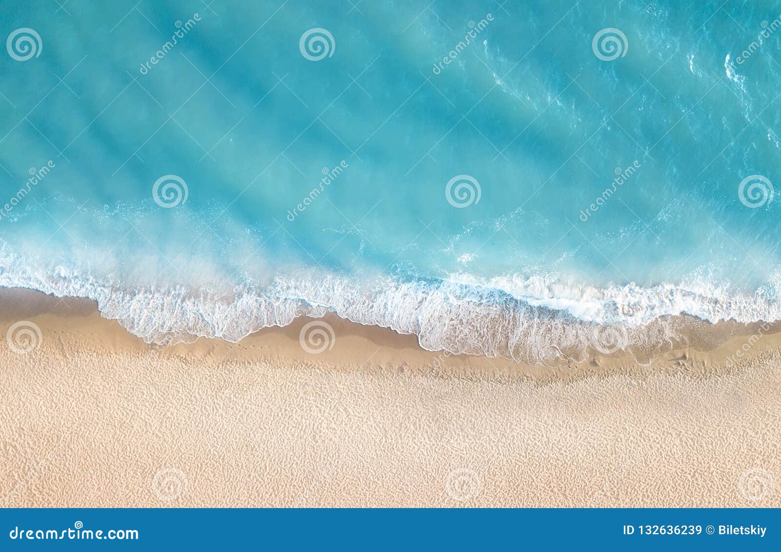 beach and waves from top view. summer seascape from air. top view from drone.