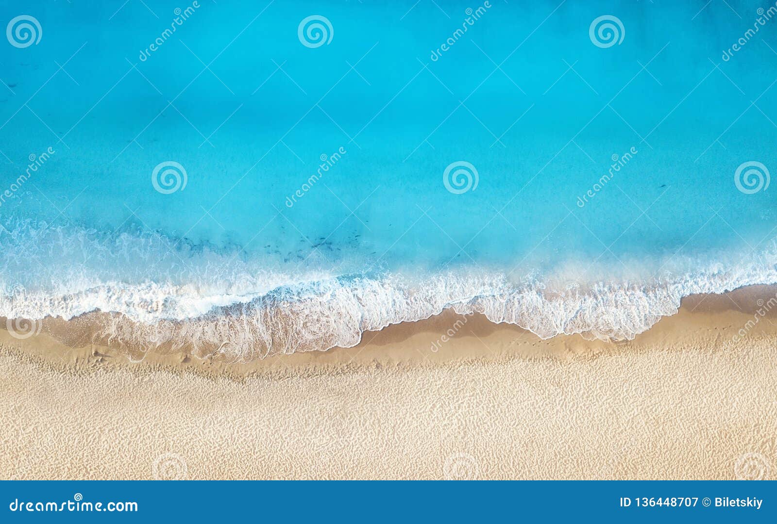 beach and waves from top view. turquoise water background from top view. summer seascape from air.