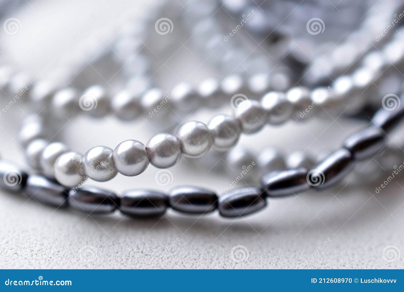 Beads of Blue Beads on a White Background Costume Jewelry Stock Photo