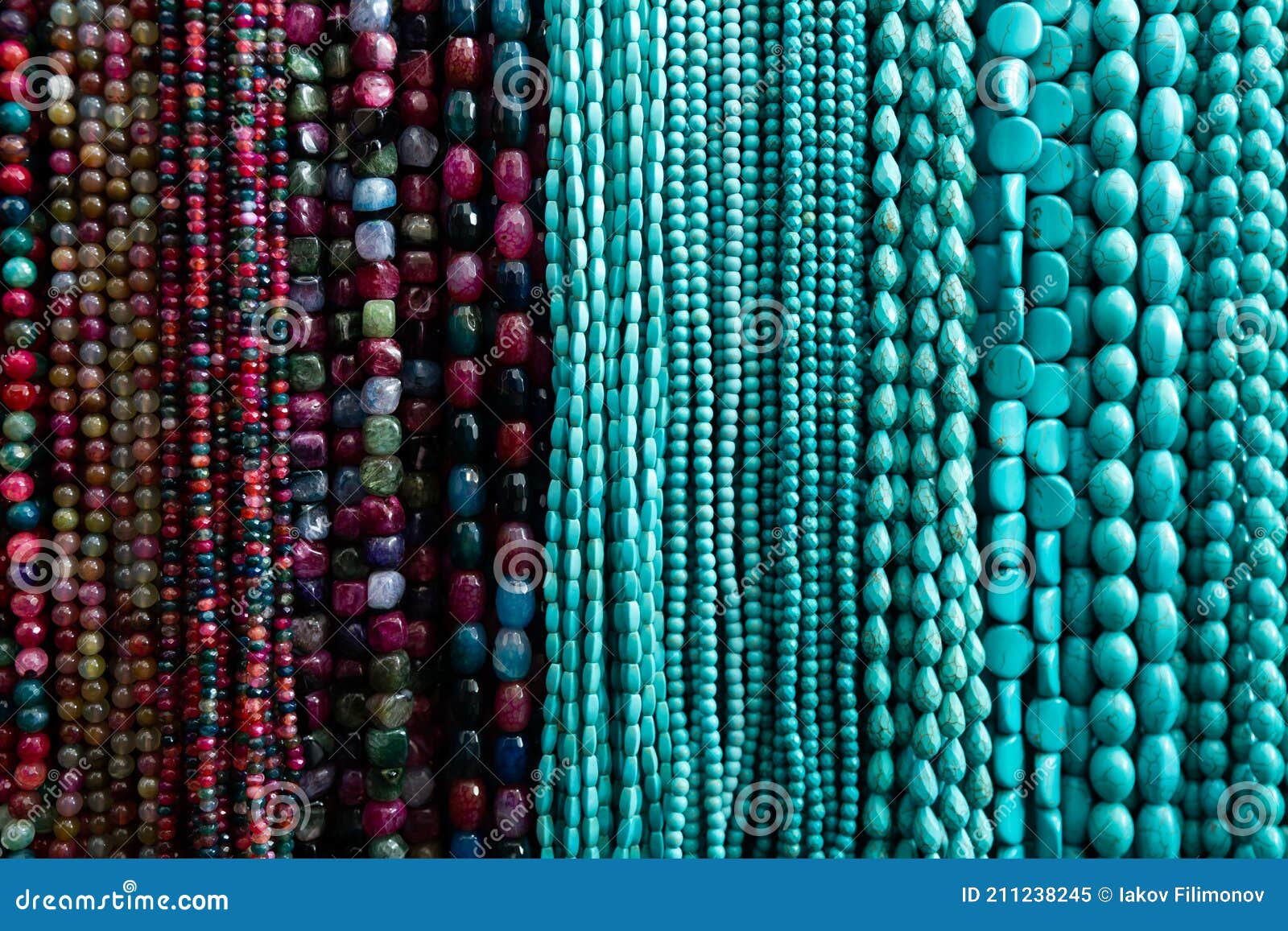Beads from Various Gemstones on the Showcase of Jewelry Store Stock