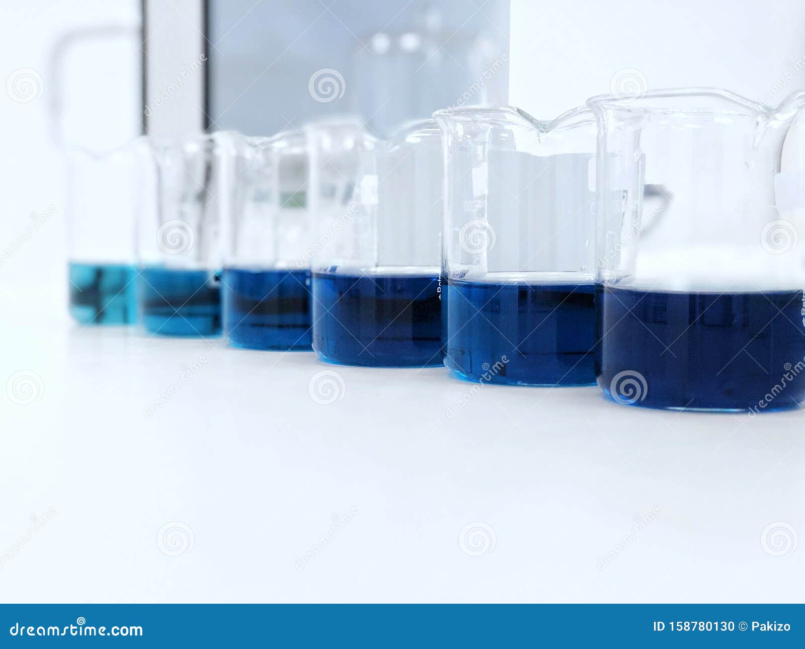 The Beakers with Color Range Solution on Bench Laboratory, with