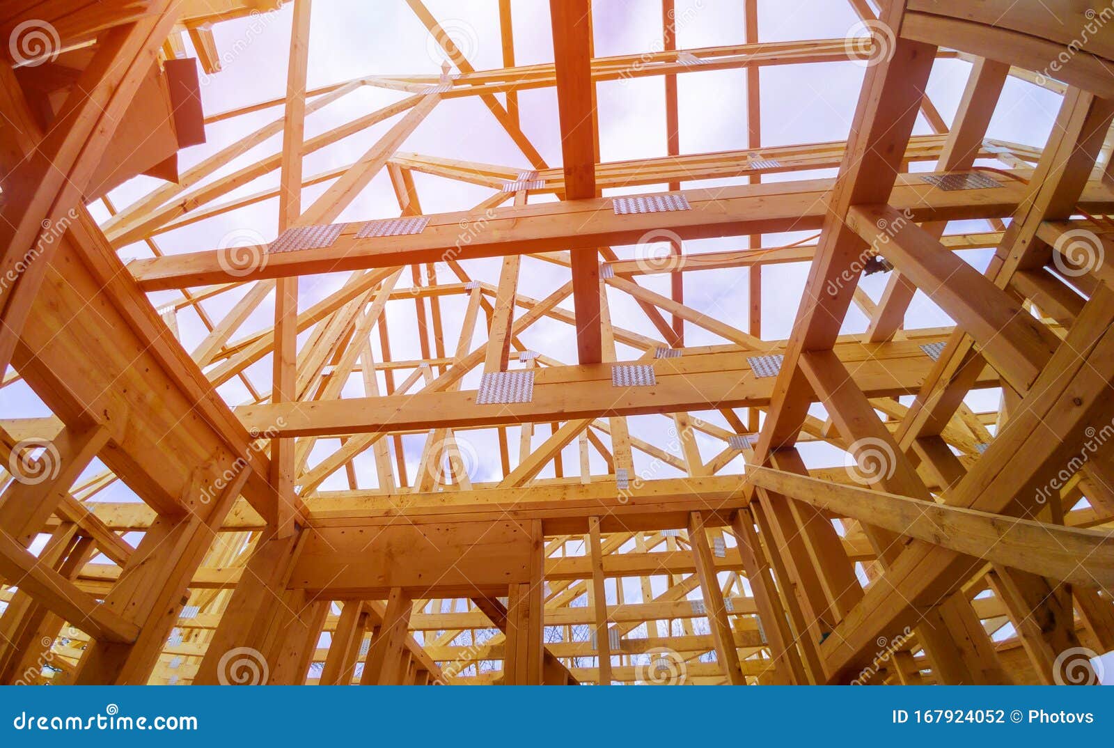 beam close-up building with under construction wooden house with timber framing