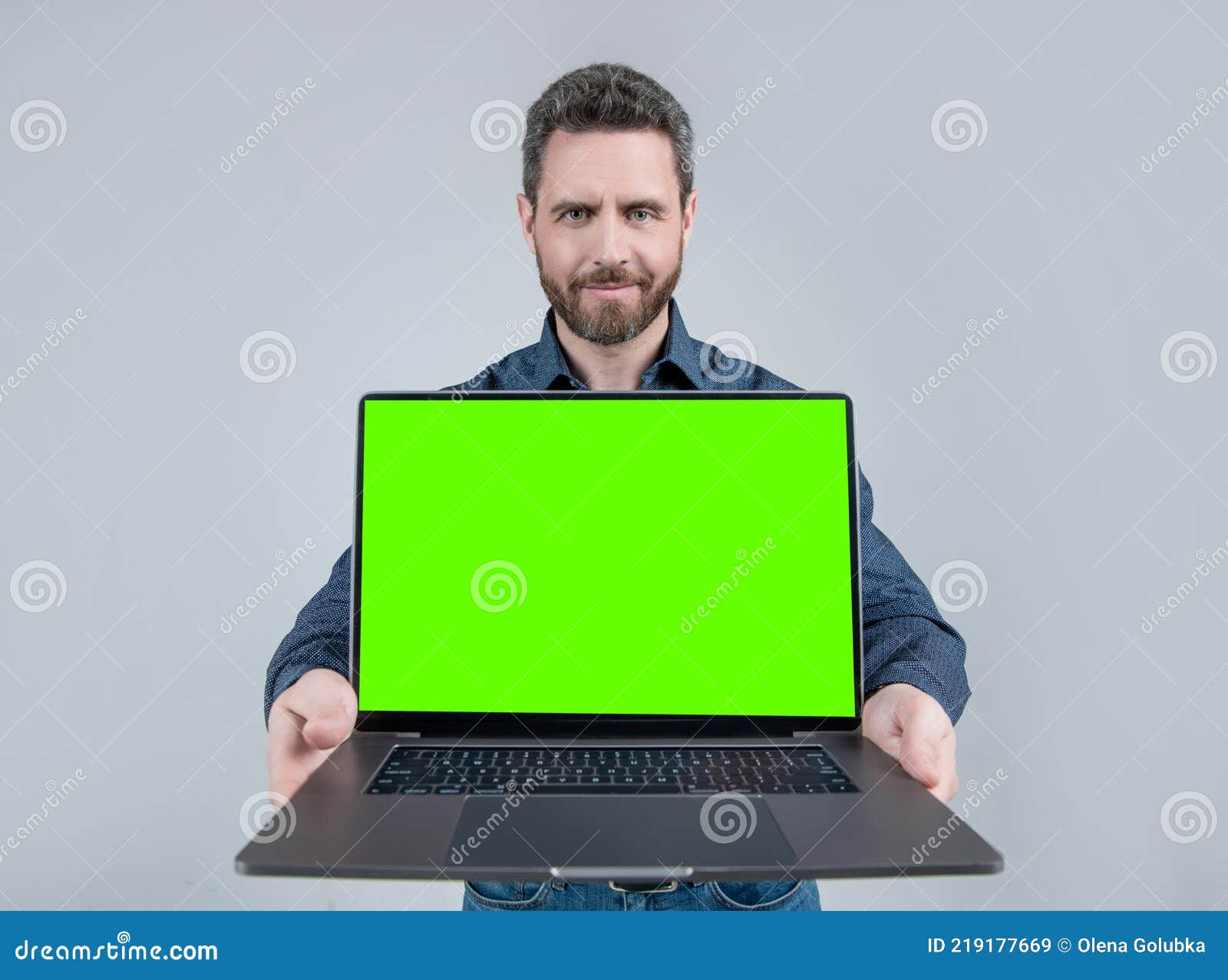 Bearded Computer Guy Hold Open Laptop with Neon Green Screen for Copy