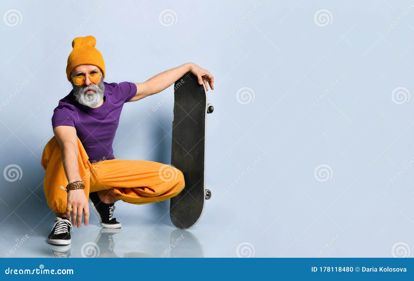 Elderly Man in T-shirt, Sunglasses, Orange Pants, Hat, Gumshoes ...