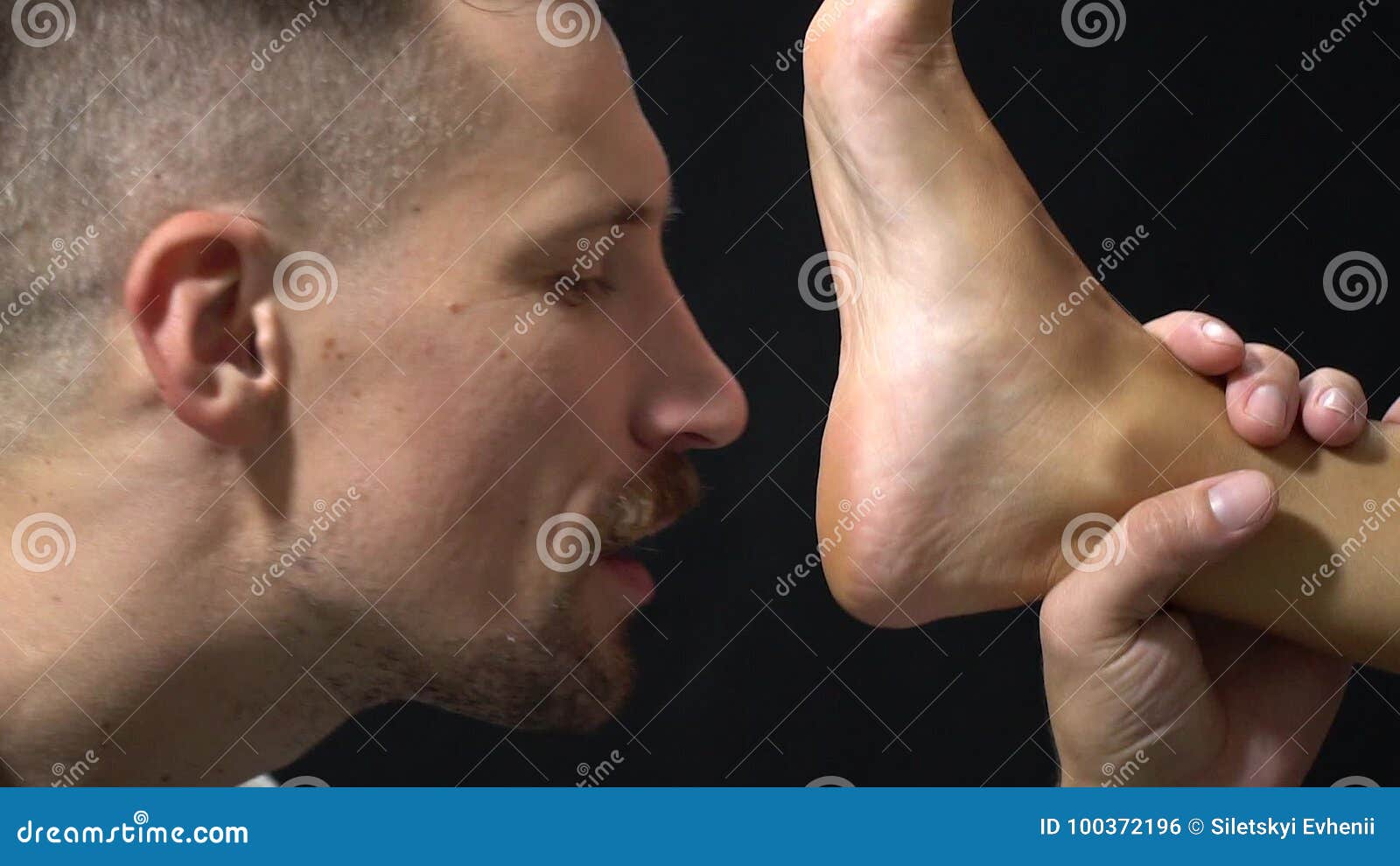 Bearded Freak Fond of Foot Fetish Stock Footage photo