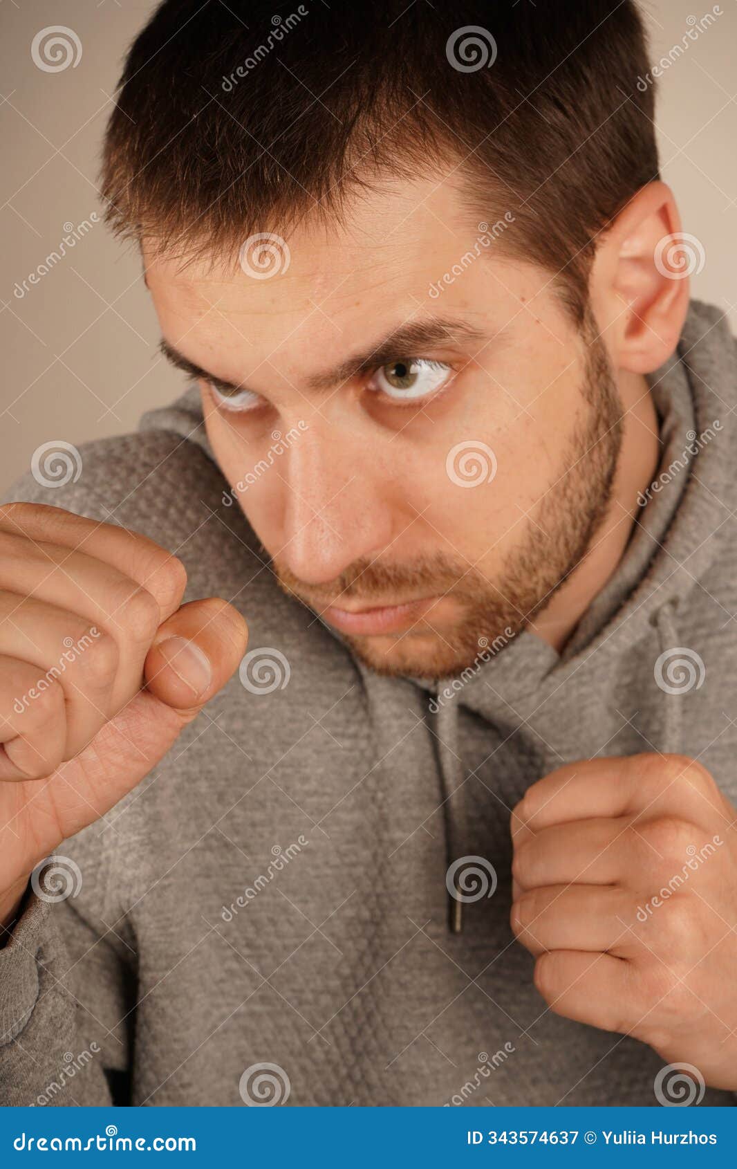 bearded man stand with clenched fists. standing in defensive position. fighting defensive action. fight and competition
