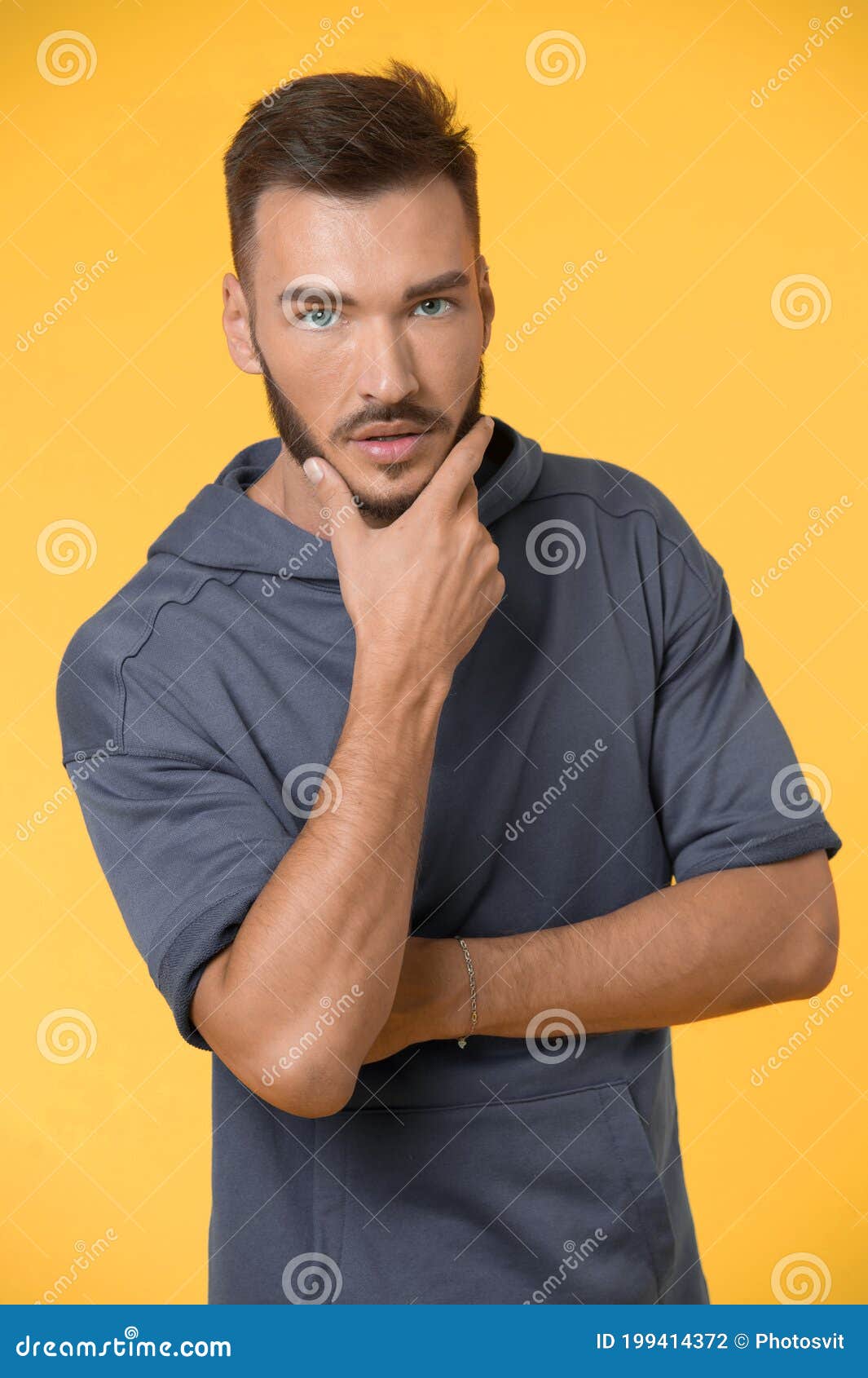 Bearded Man Touch Beard with Hand. Man with Bearded Face. Bearded Man