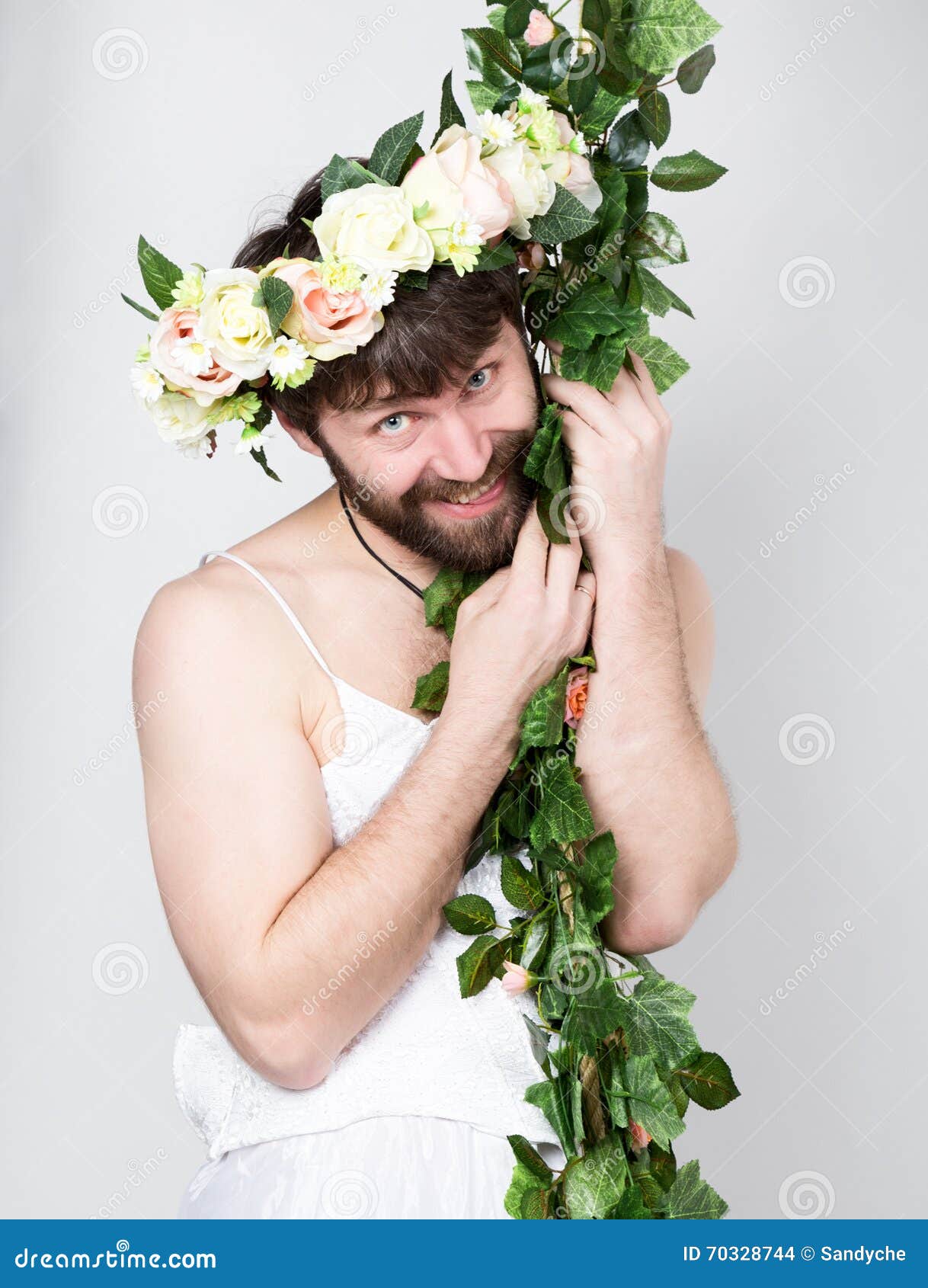 Bearded Man in a Woman S Wedding Dress on Her Naked Body, Clinging To the  Vine. on His Head a Wreath of Flowers Stock Photo - Image of agent,  assistance: 70328744