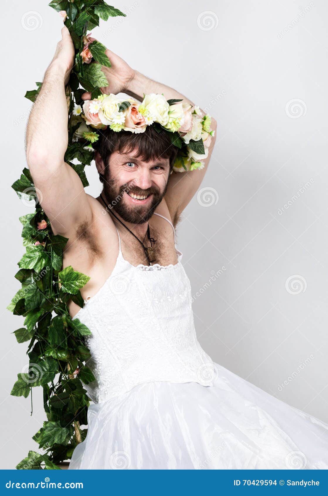 Bearded Man in a Woman S Wedding Dress on Her Naked Body, Clinging To the  Vine. on His Head a Wreath of Flowers Stock Photo - Image of online,  network: 70429594