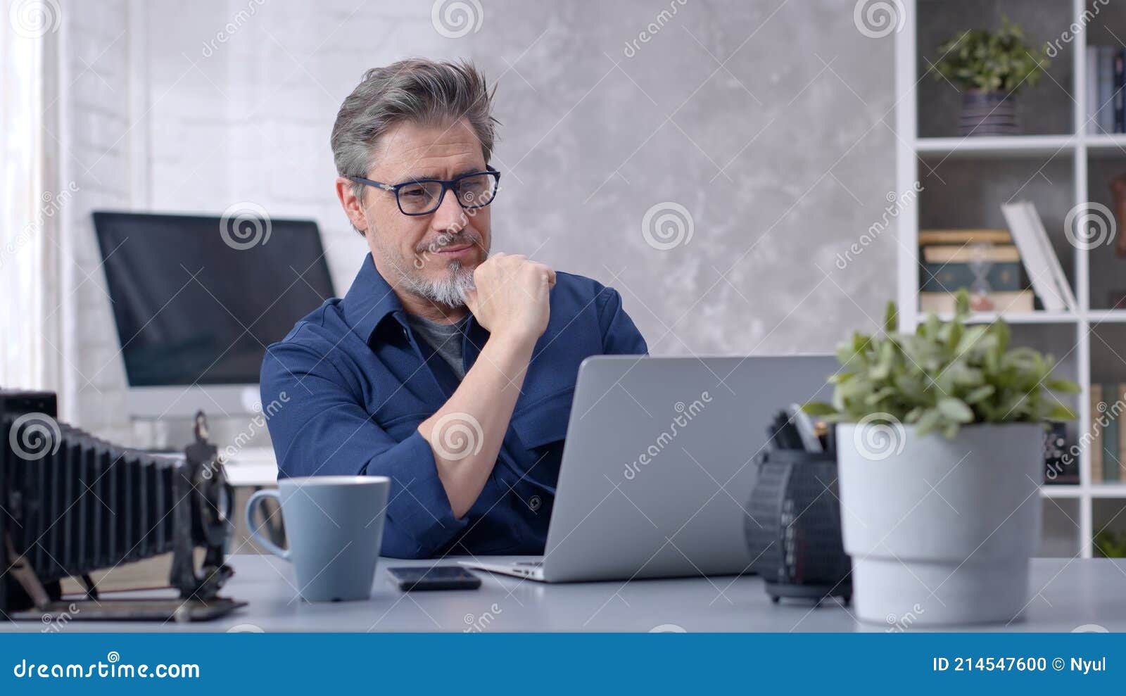man working with laptop at home office