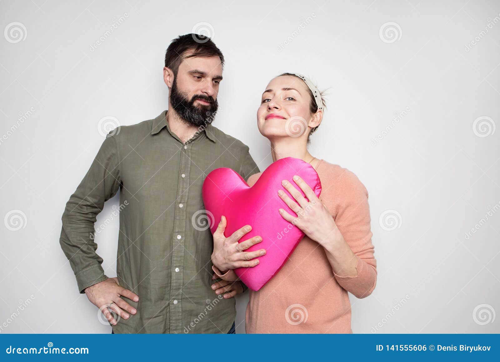 Bearded Man And Young Girl Play With Red Soft Toy Heart Couple In