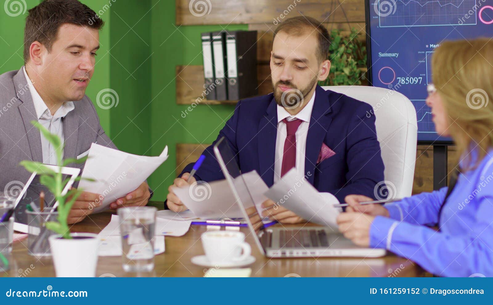 Bearded Team Leader In Business Suit Having A Meeting With His
