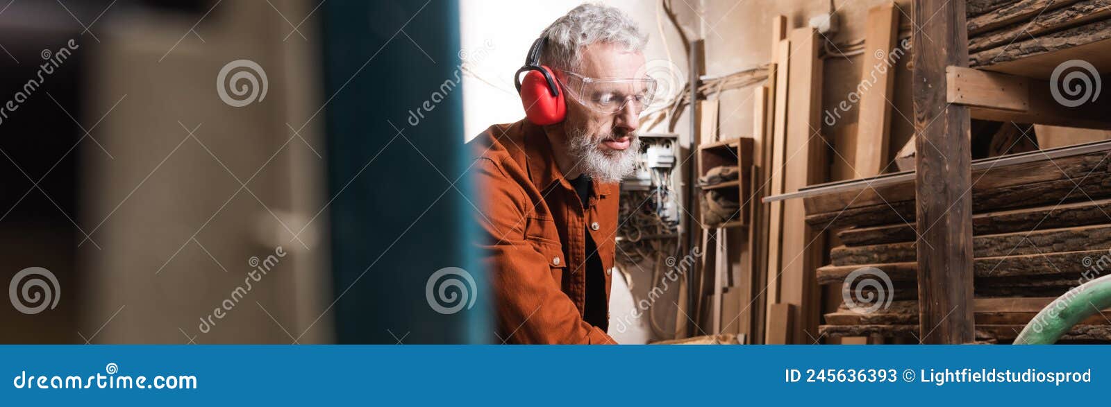 Bearded Woodworker in Earmuffs and Goggles Stock Image Image of