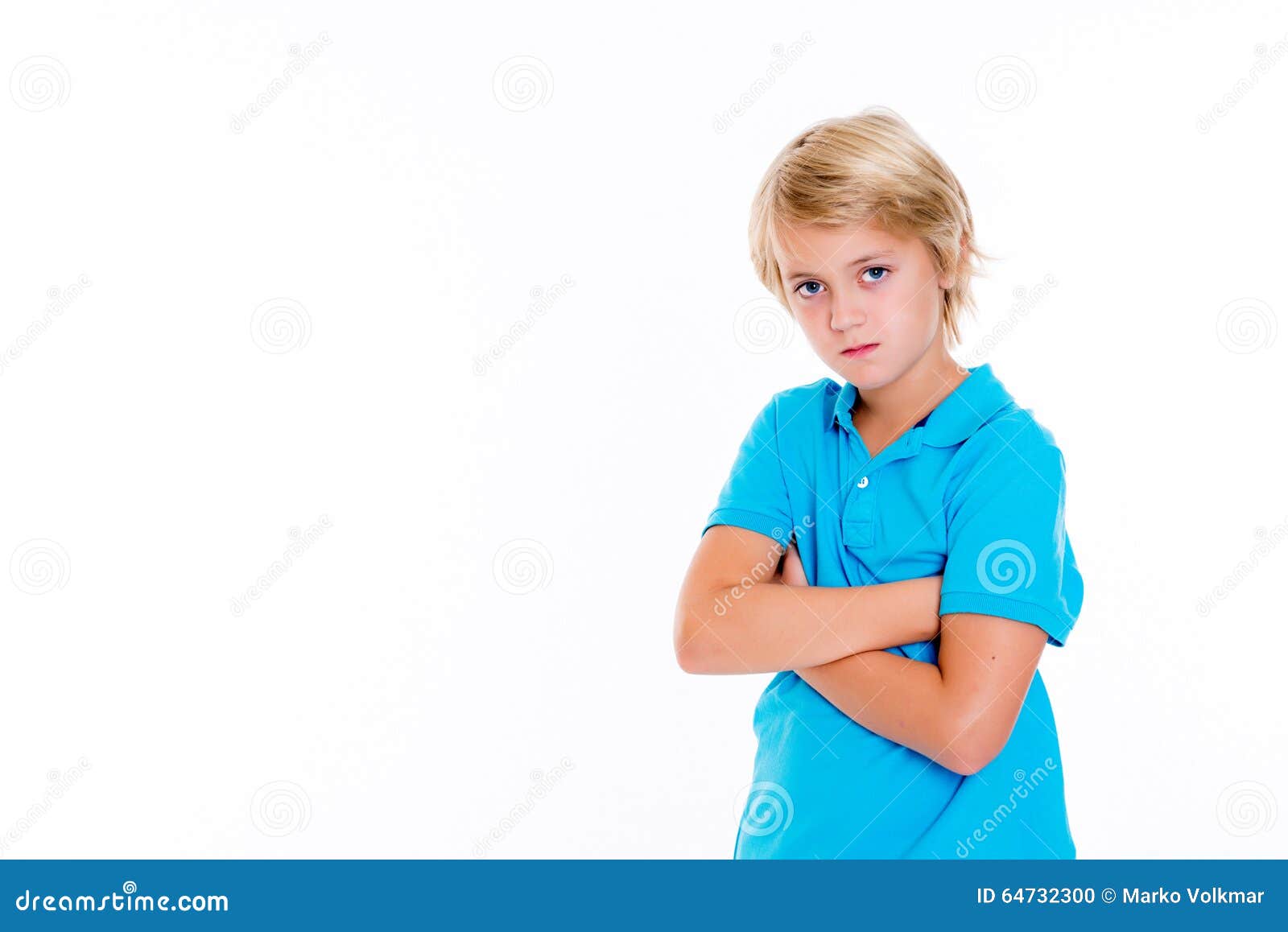 bearish blond boy with crossed arms