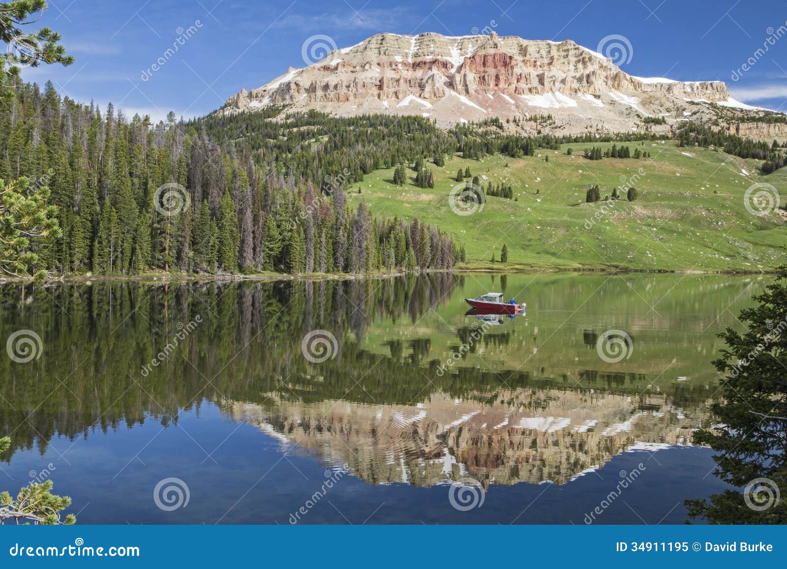 beartooth butte and bear lake with fishing boat