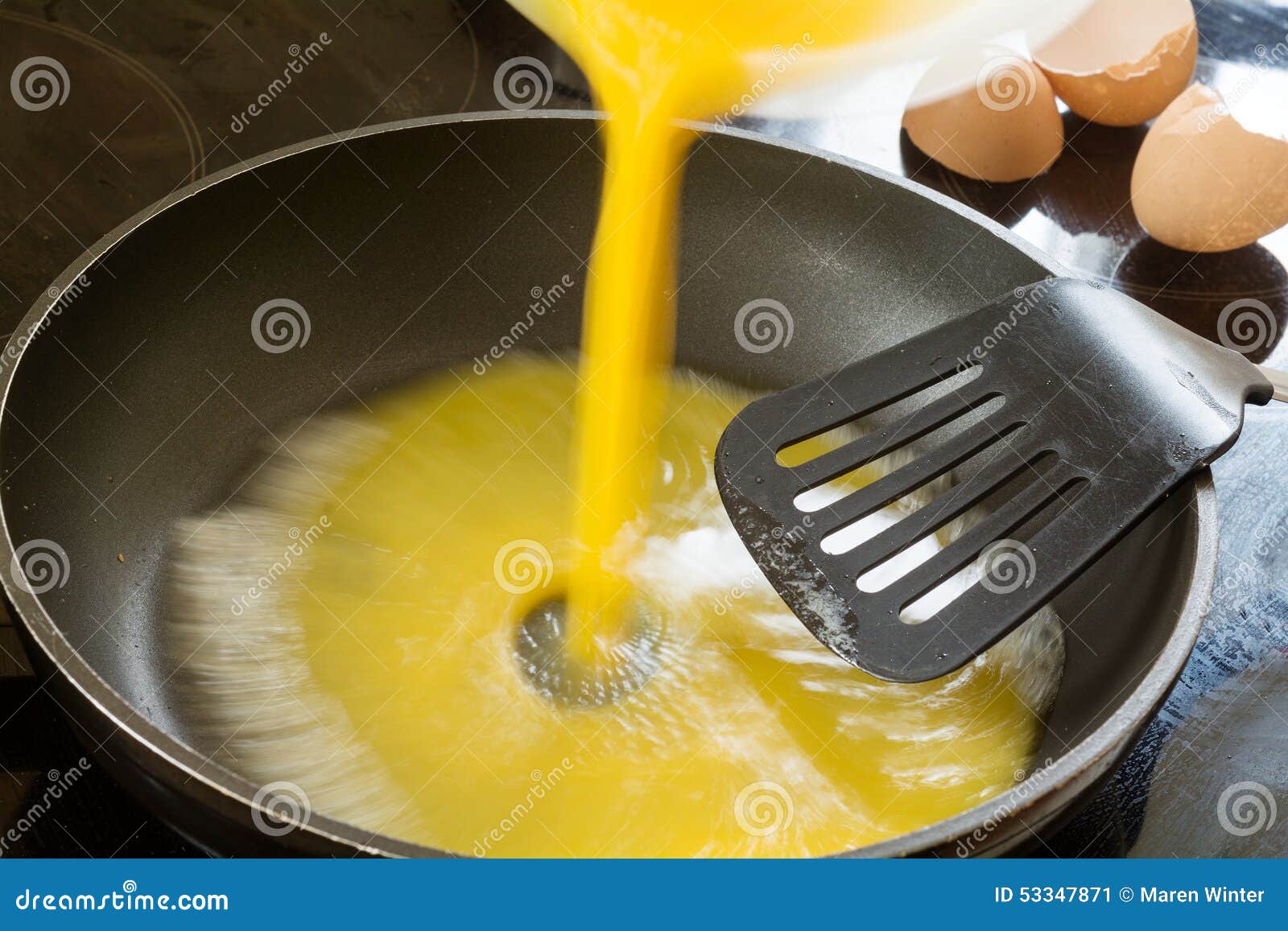 Beaten Egg Flowing into the Pan for Scrambled Eggs Stock Image Image