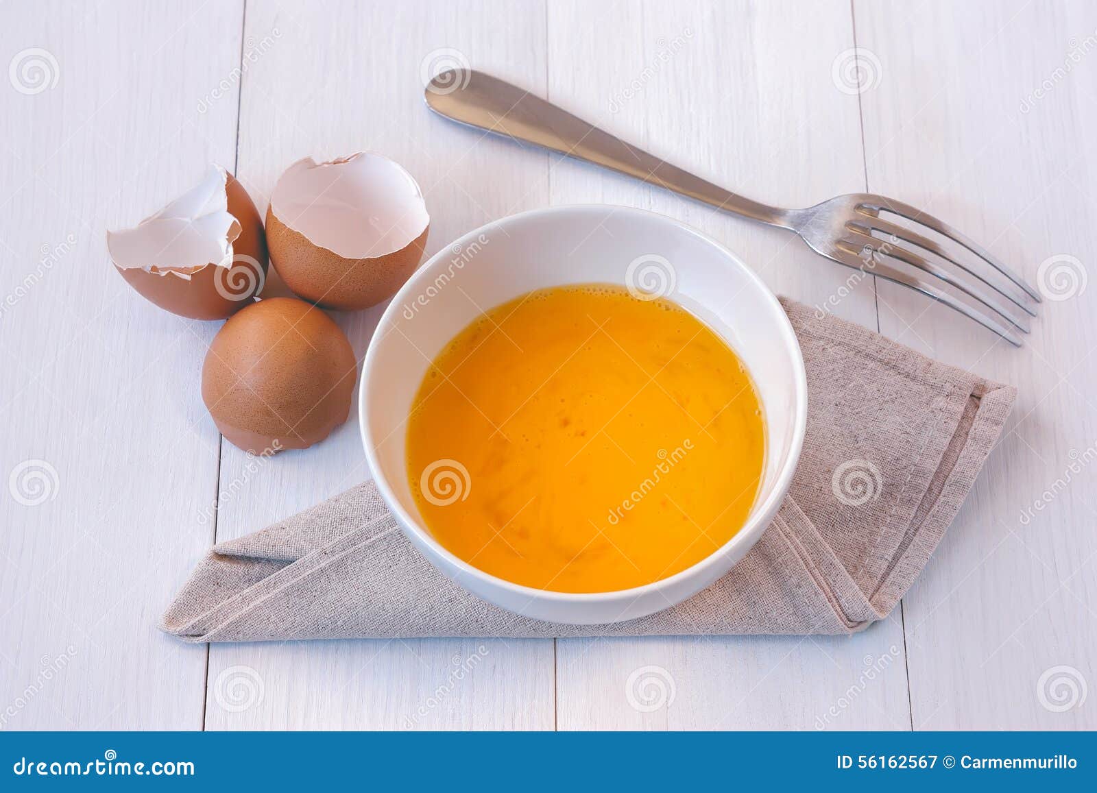 Beaten Egg Yolks In A Bowl With Fork Stock Image Image of napkin