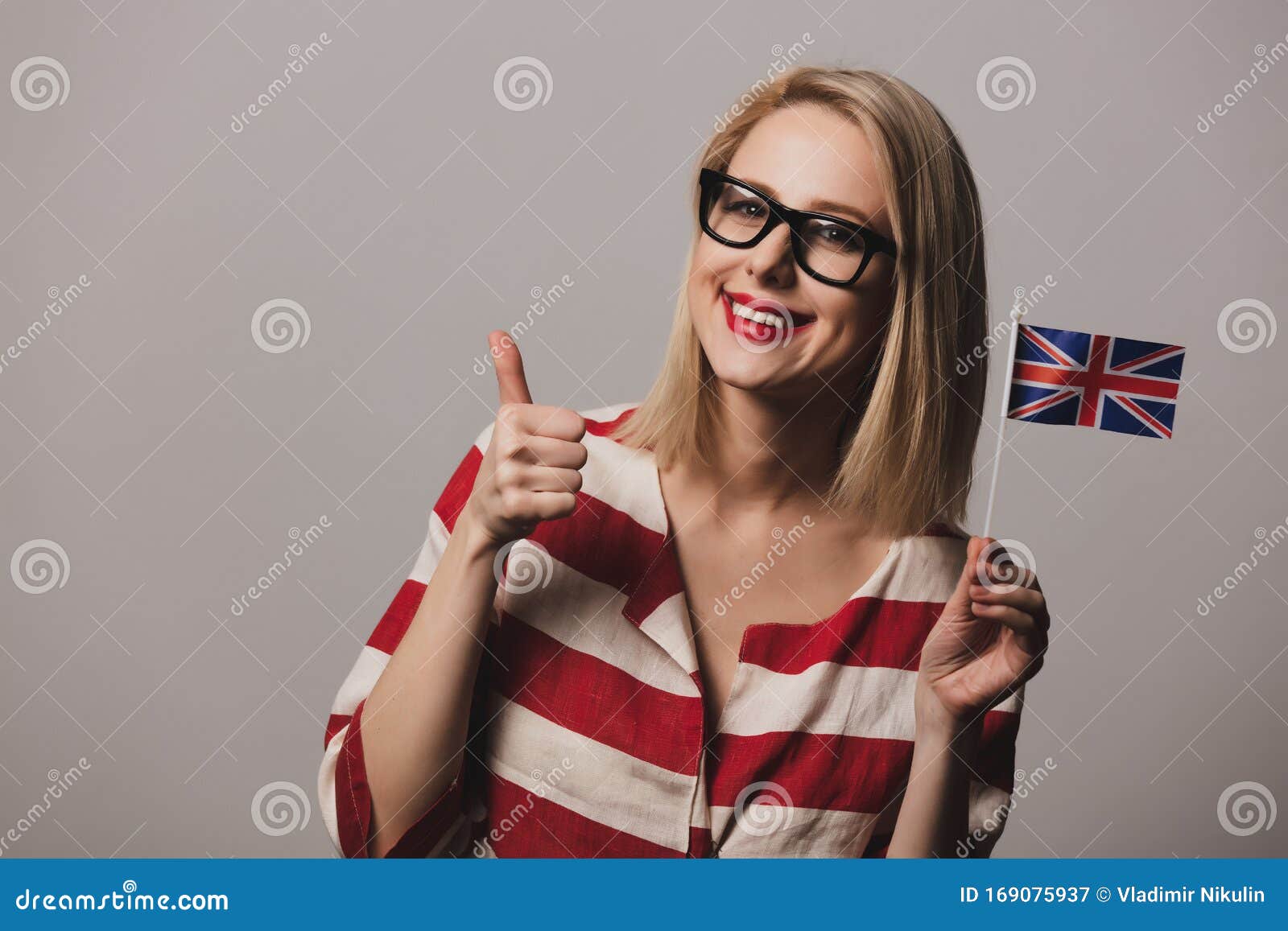 Girl Holds British Flag on Gray Background Stock Image - Image of ...