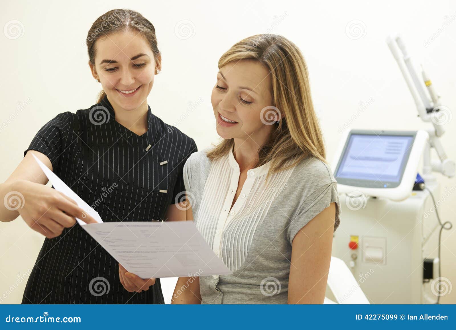 beautician discussing treatment with female client