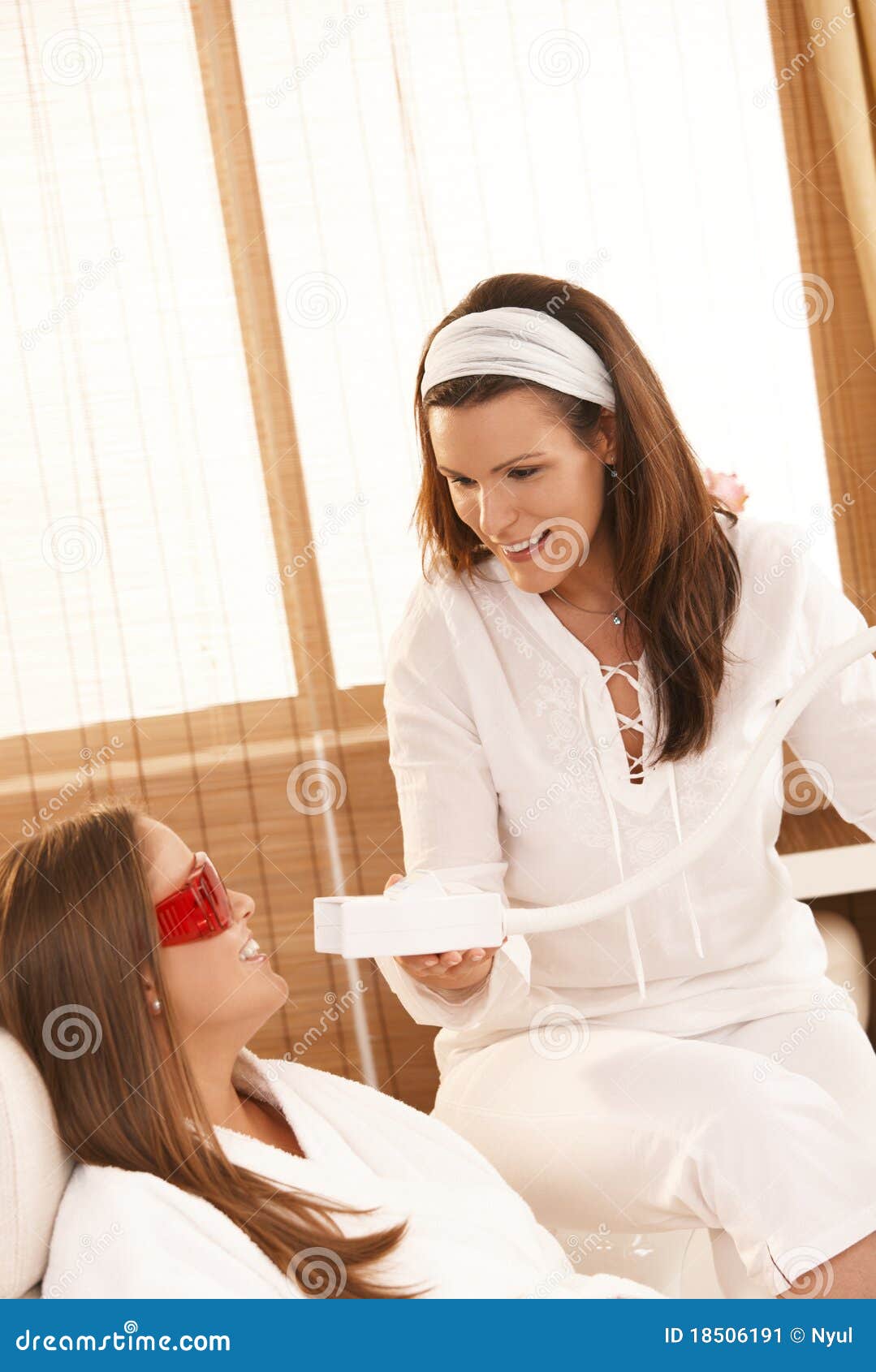 beautician doing tooth whitening