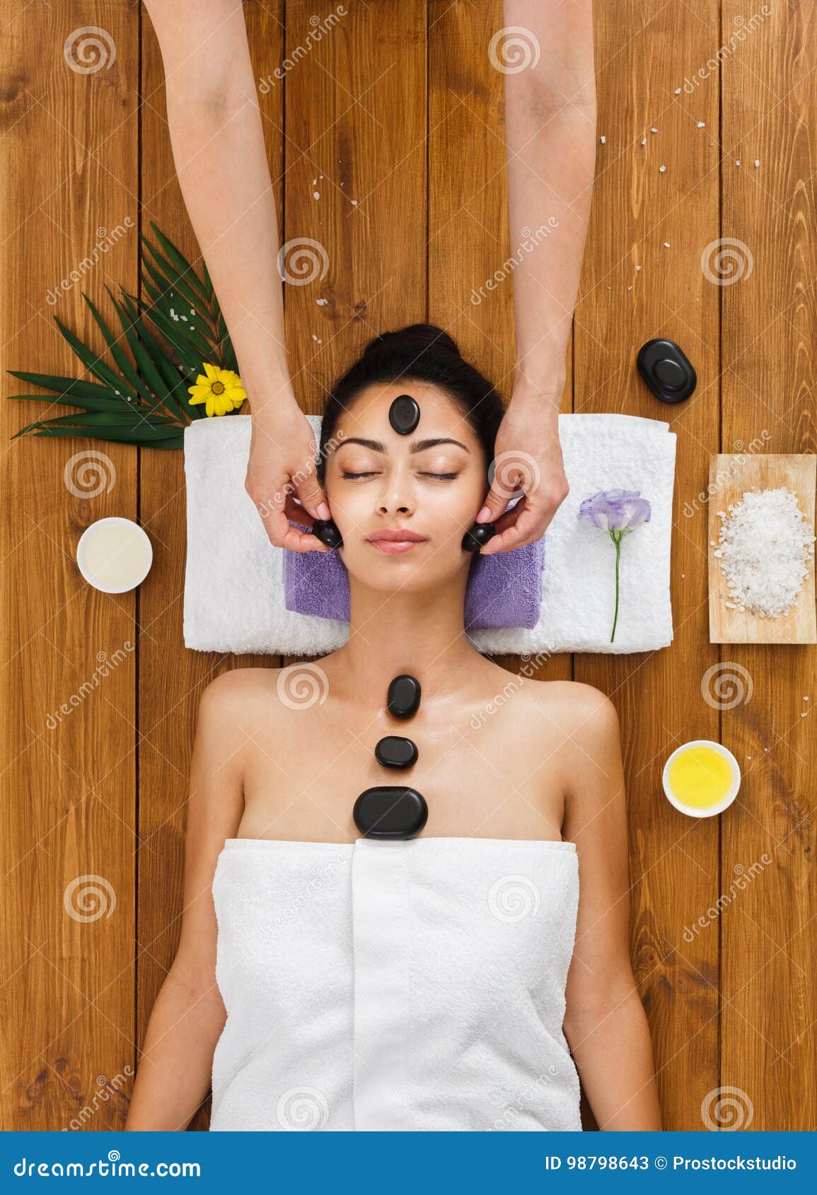 Beautician Make Stone Massage Spa For Woman At Wellness Center Stock