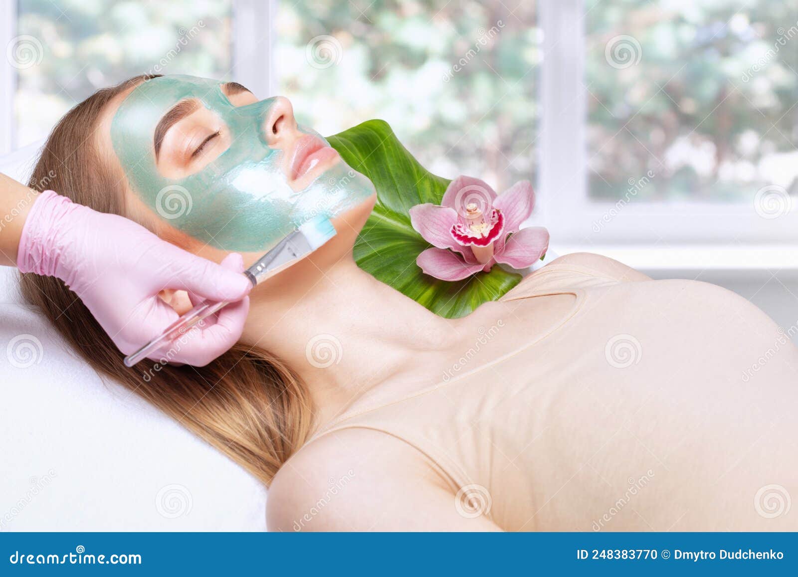 Beautician Makes A Face Mask Of A Woman To Rejuvenate The Skin Cosmetology Treatment Of Problem