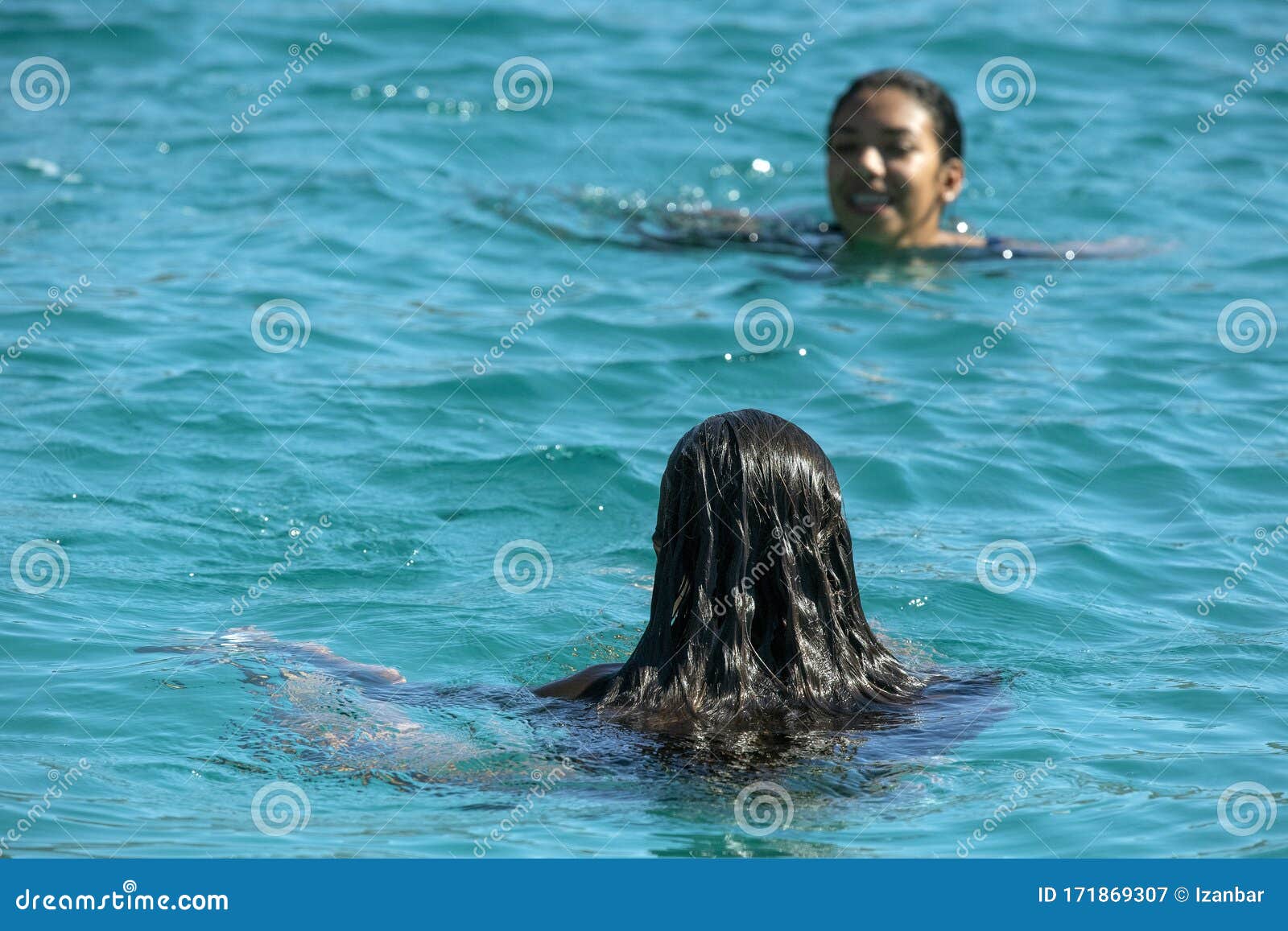 Black Hair Mexican Latina Girl Swimming In Crystal Sea Waters St