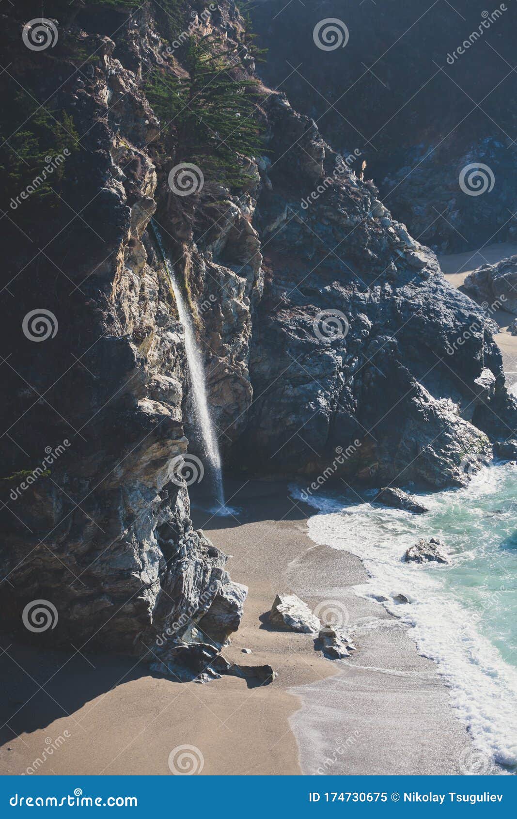 beautiful aerial view of mcway falls with julia pfeiffer beach and pacific ocean, big sur, monterey county, california, united
