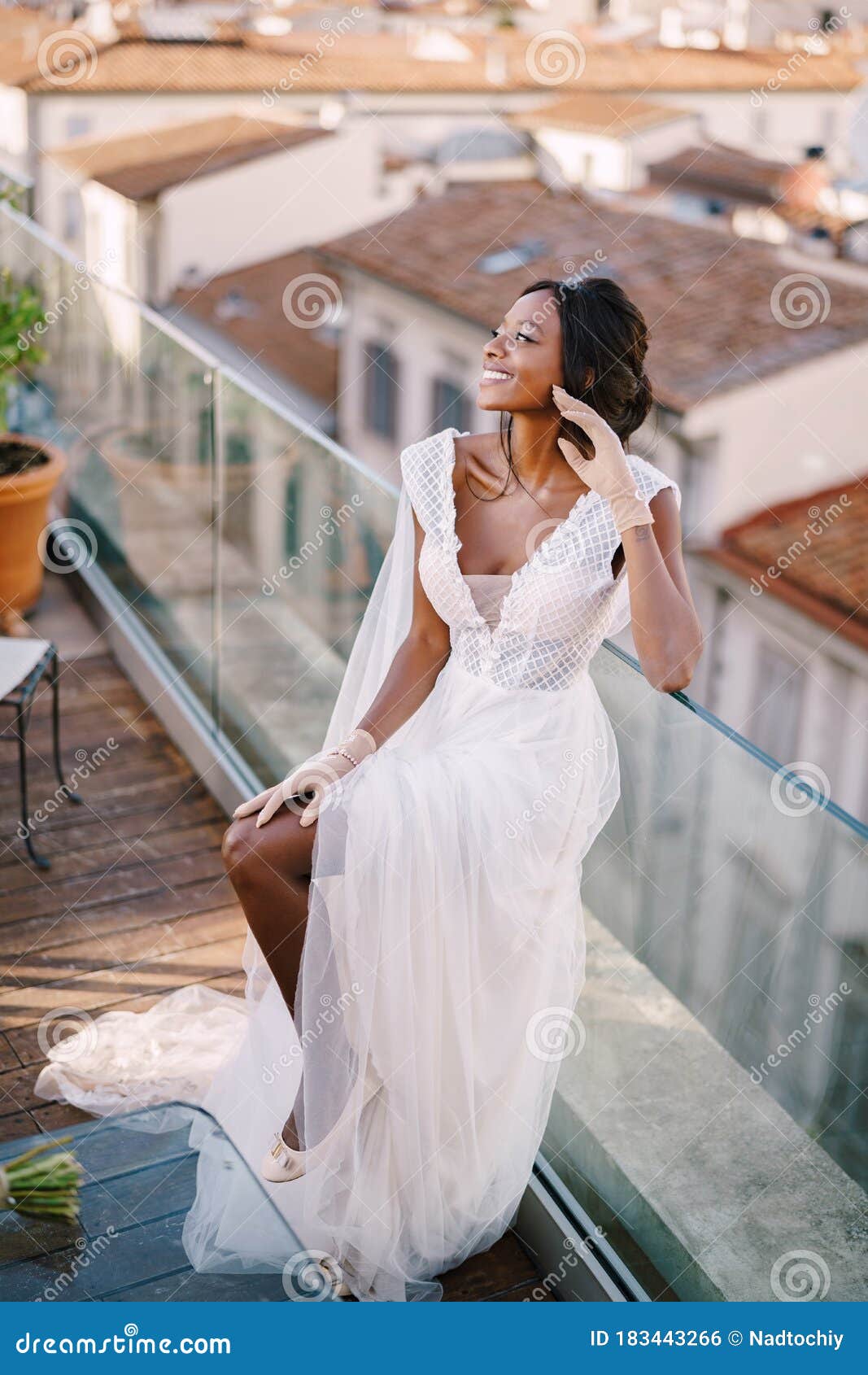 Beautiful African American Bride in a White Wedding Dress, Touches