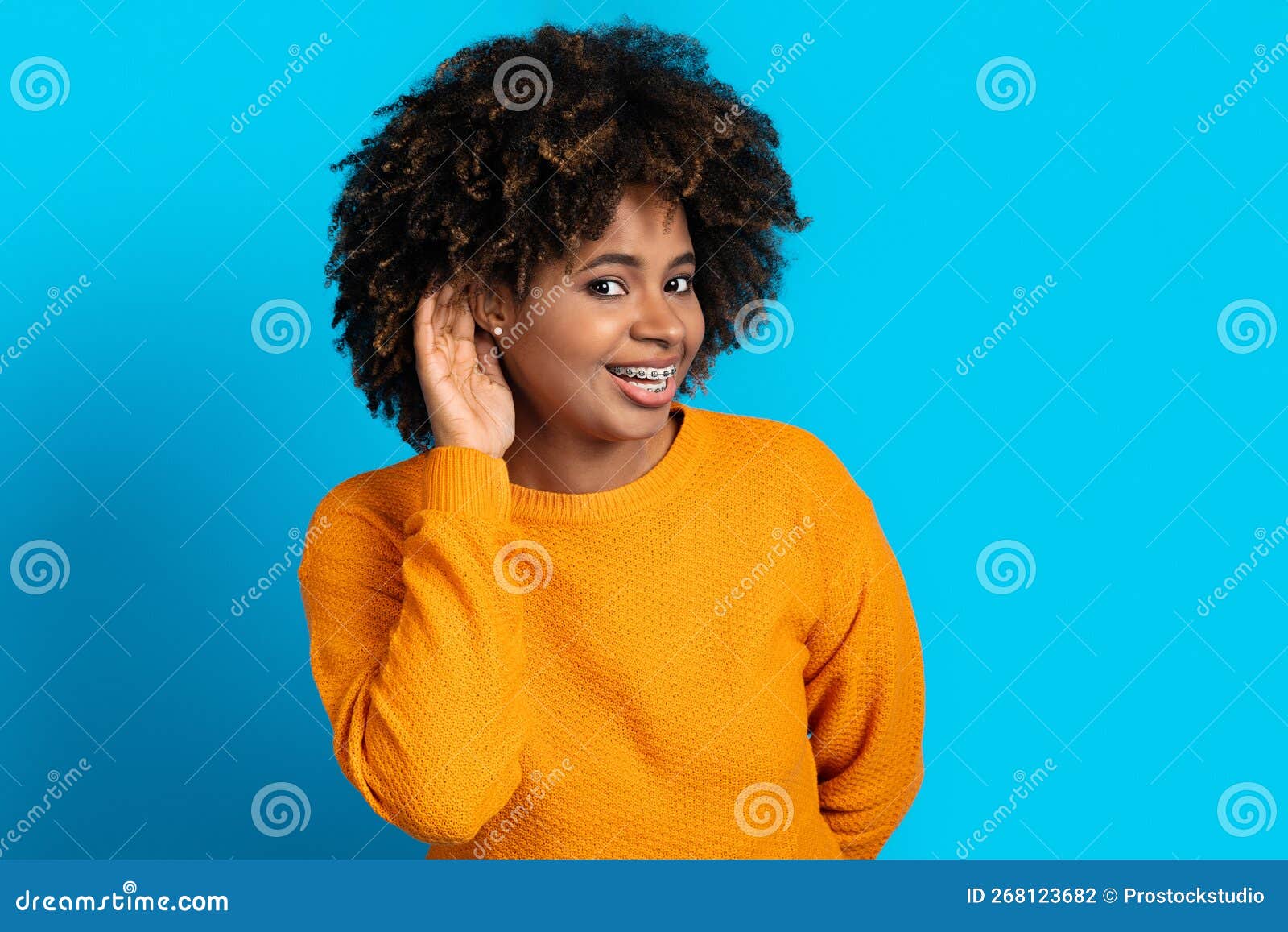 Beautiful African Woman Holding Hand Near Ear Trying To Listen Stock