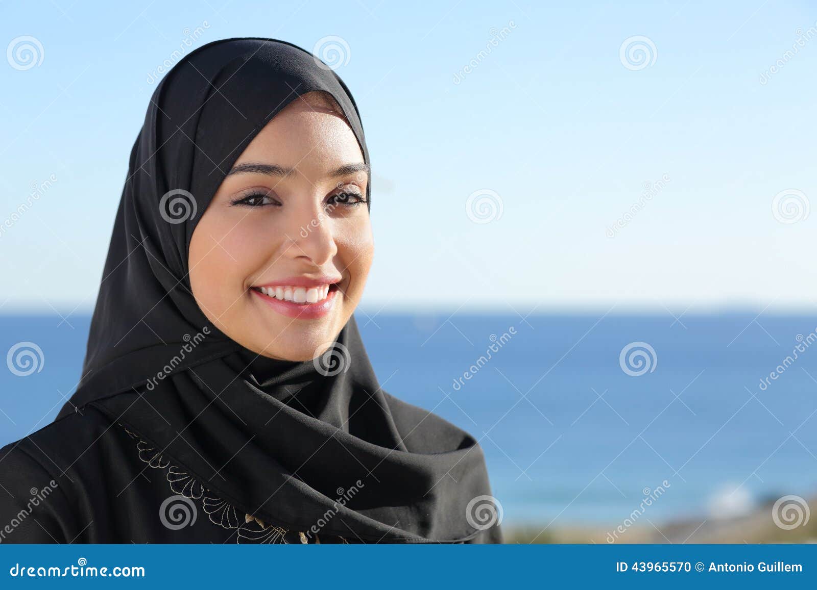 beautiful arab saudi woman face posing on the beach