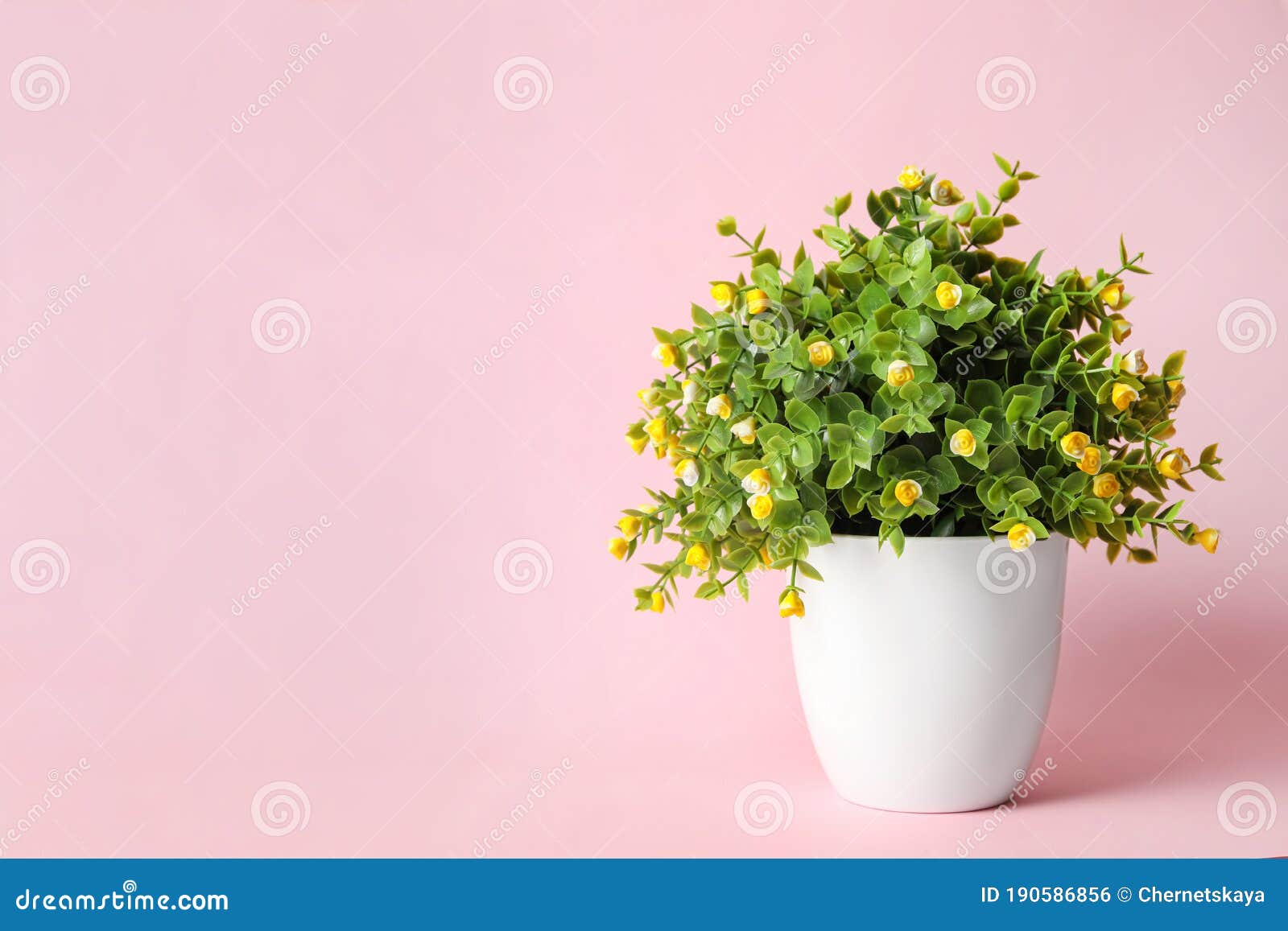 Artificial Plant in Flower Pot on Pink Background, Space for Text Stock