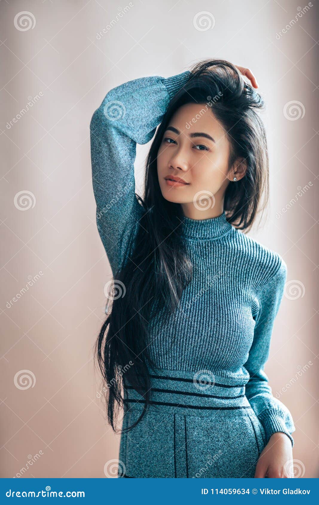 Beautiful Asian Woman In Blue Dress Posing In Studio Stock Photo ...