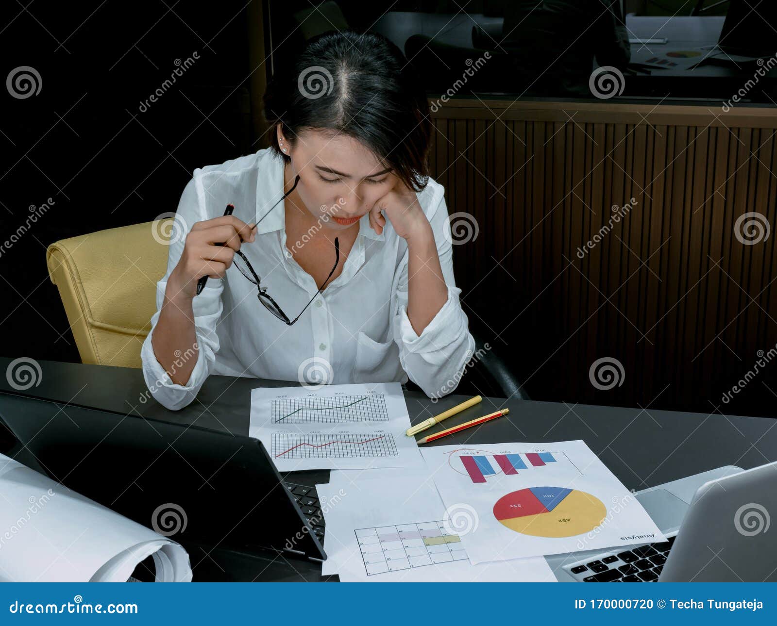 Beautiful Asian Woman Working Overtime With Laptop Computer On