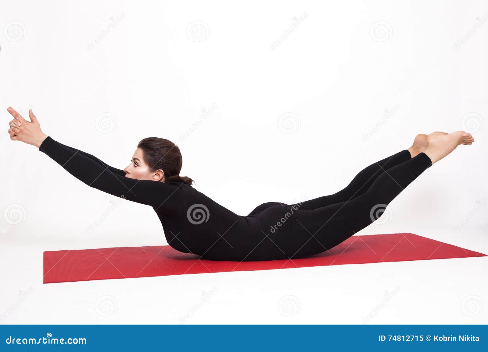 Beautiful athletic girl in a black suit doing yoga. viparita naukasana  asana boat pose. Isolated on white background. Stock Photo by ©kobrin-photo  117674498