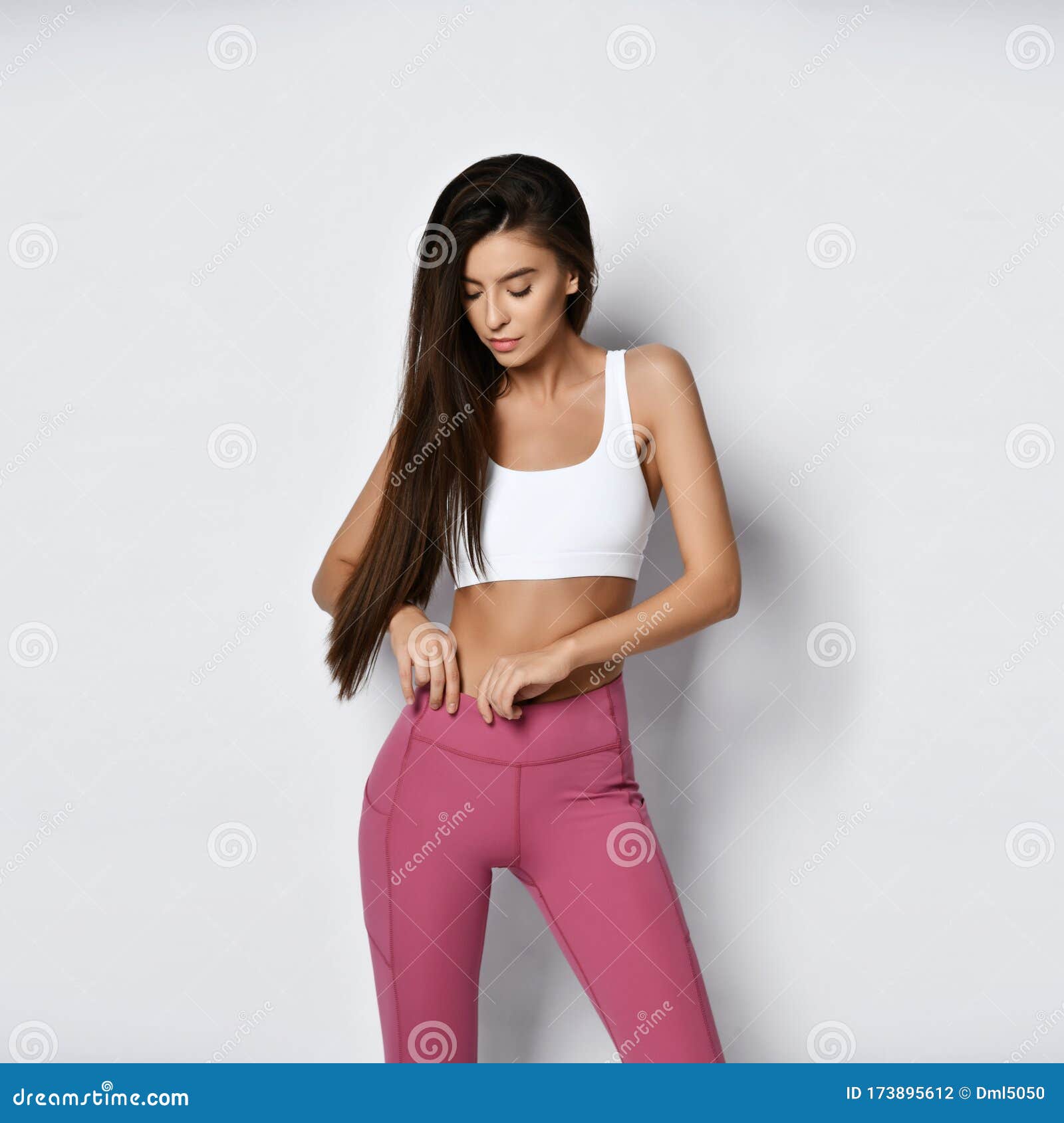 https://thumbs.dreamstime.com/z/beautiful-athletic-girl-sportswear-looks-measures-her-waist-looks-how-much-managed-to-lose-weight-beautiful-athletic-173895612.jpg