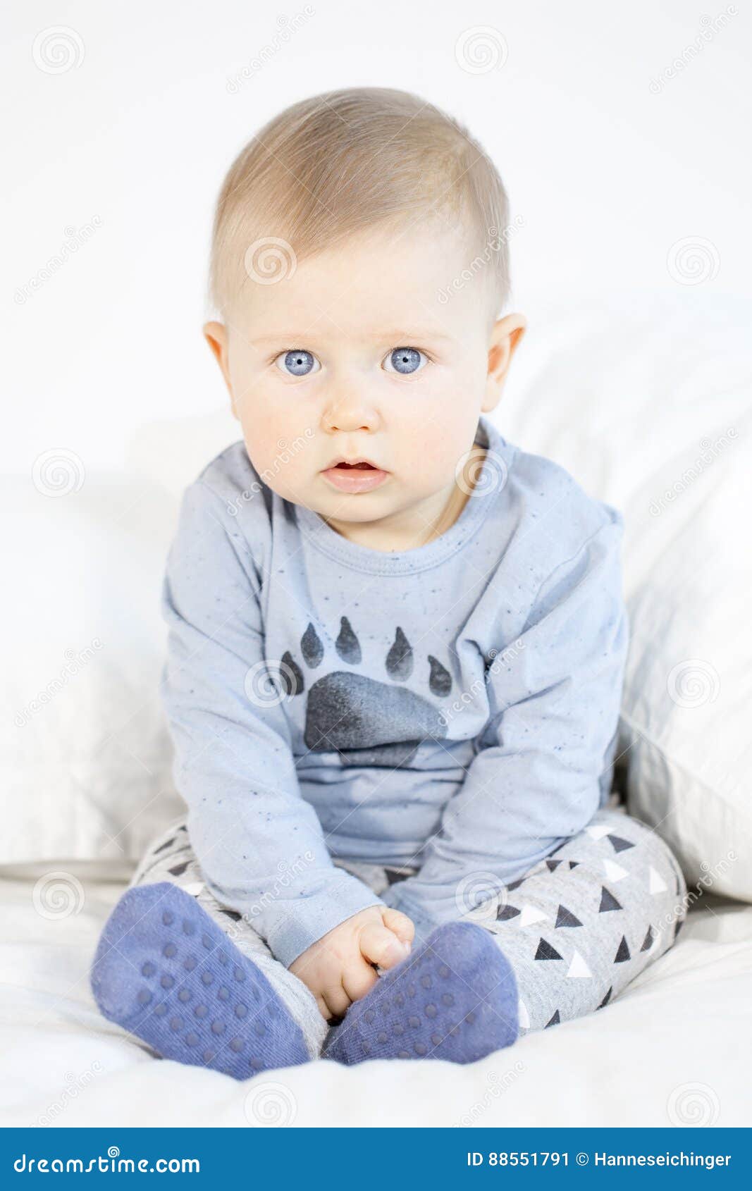 Beautiful Baby Boy Sitting in Bed on White Background Stock Image ...