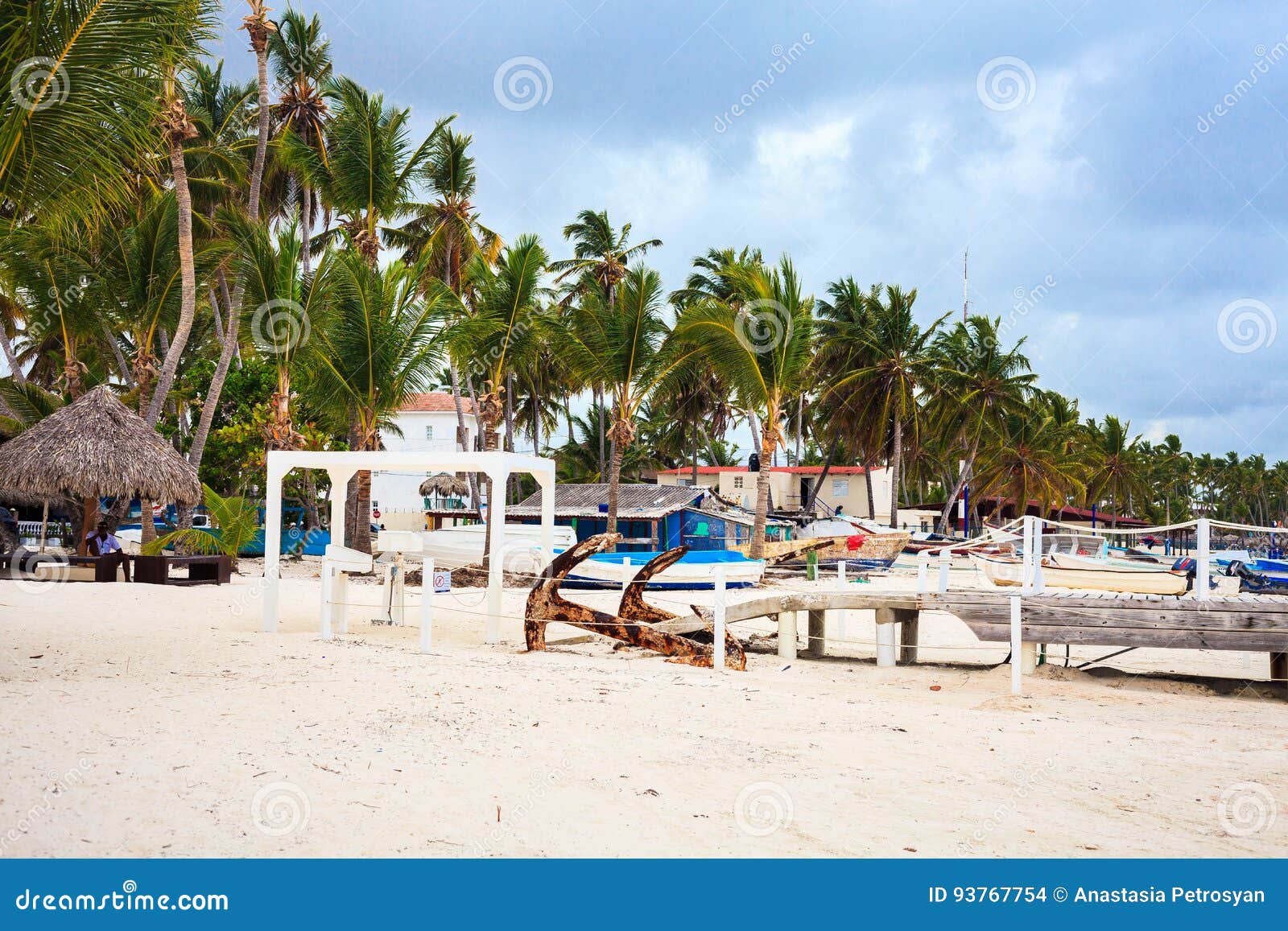 beautiful beach in cabeza de toro with boats and bridge, punta cana