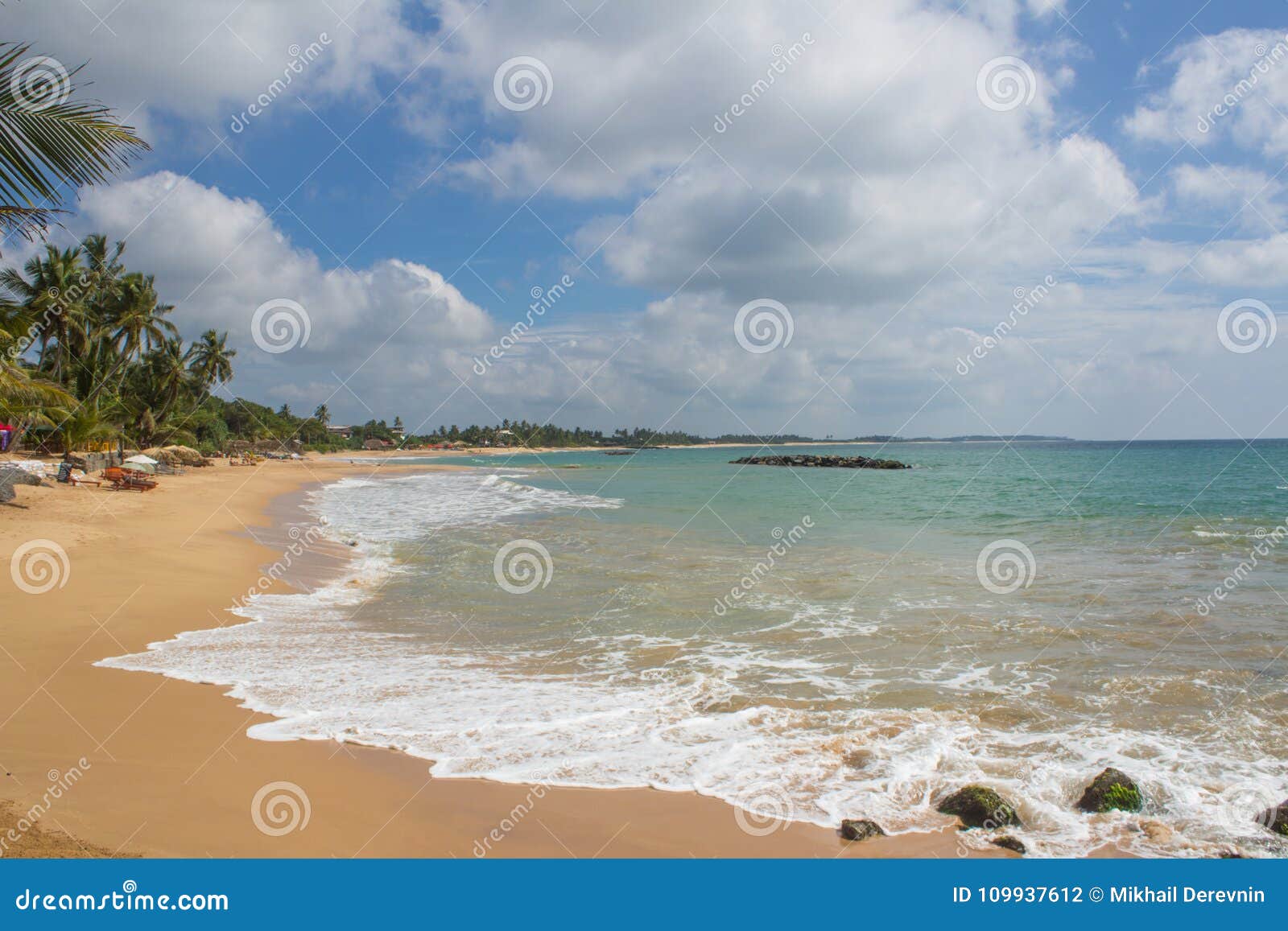 beautiful beach. view of nice tropical beach with palms around.