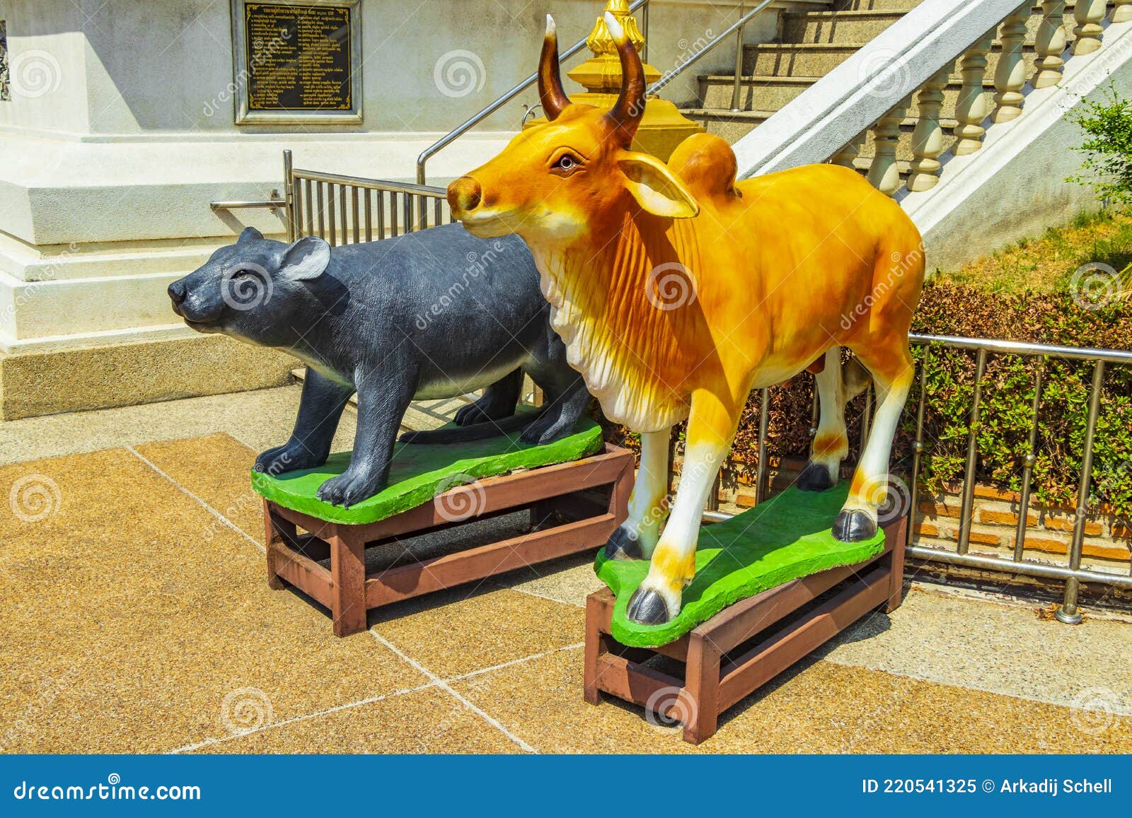 black bear and cow statues don mueang temple bangkok thailand