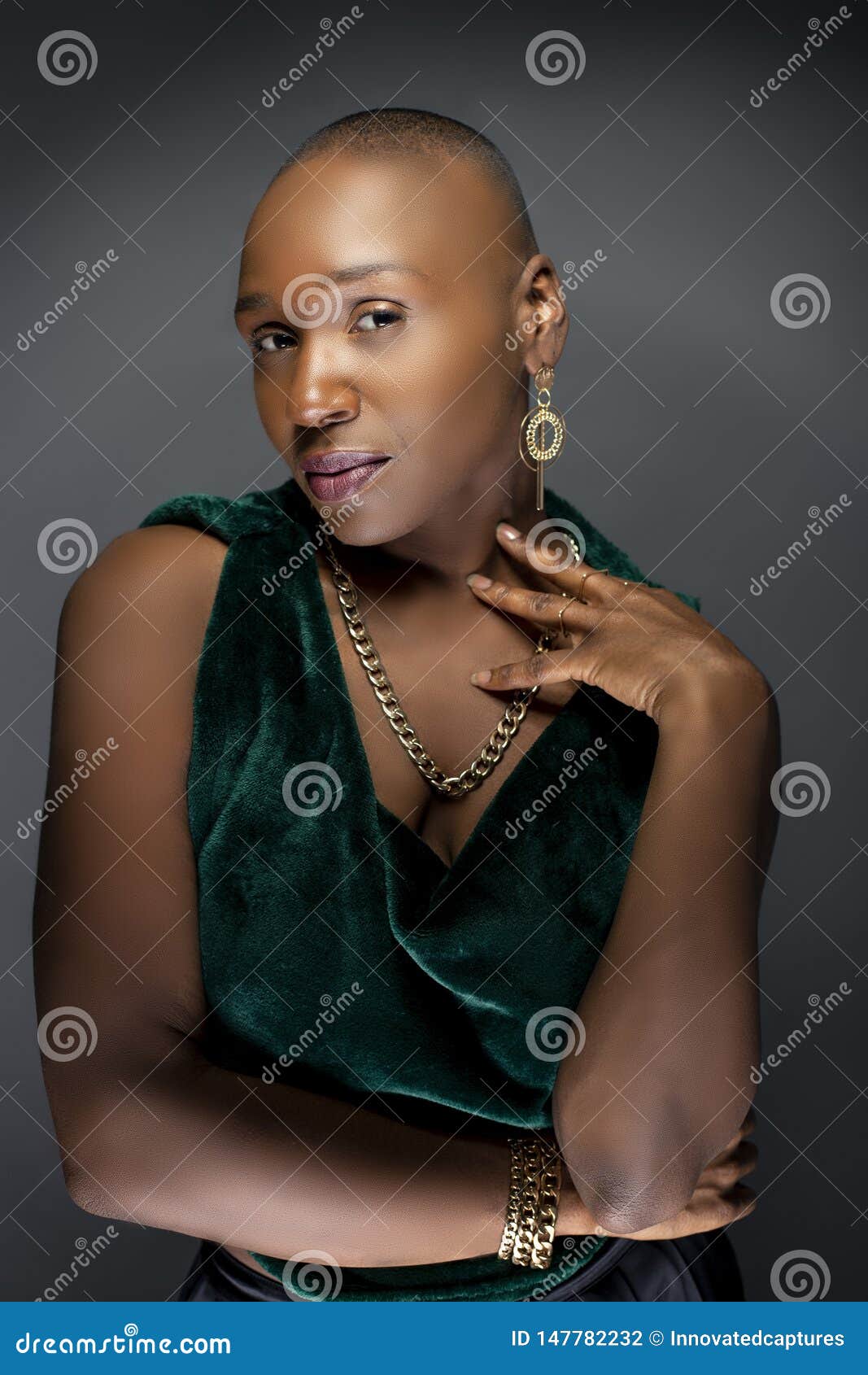 Black Female Fashion Model With Bald Hairstyle Lookin
