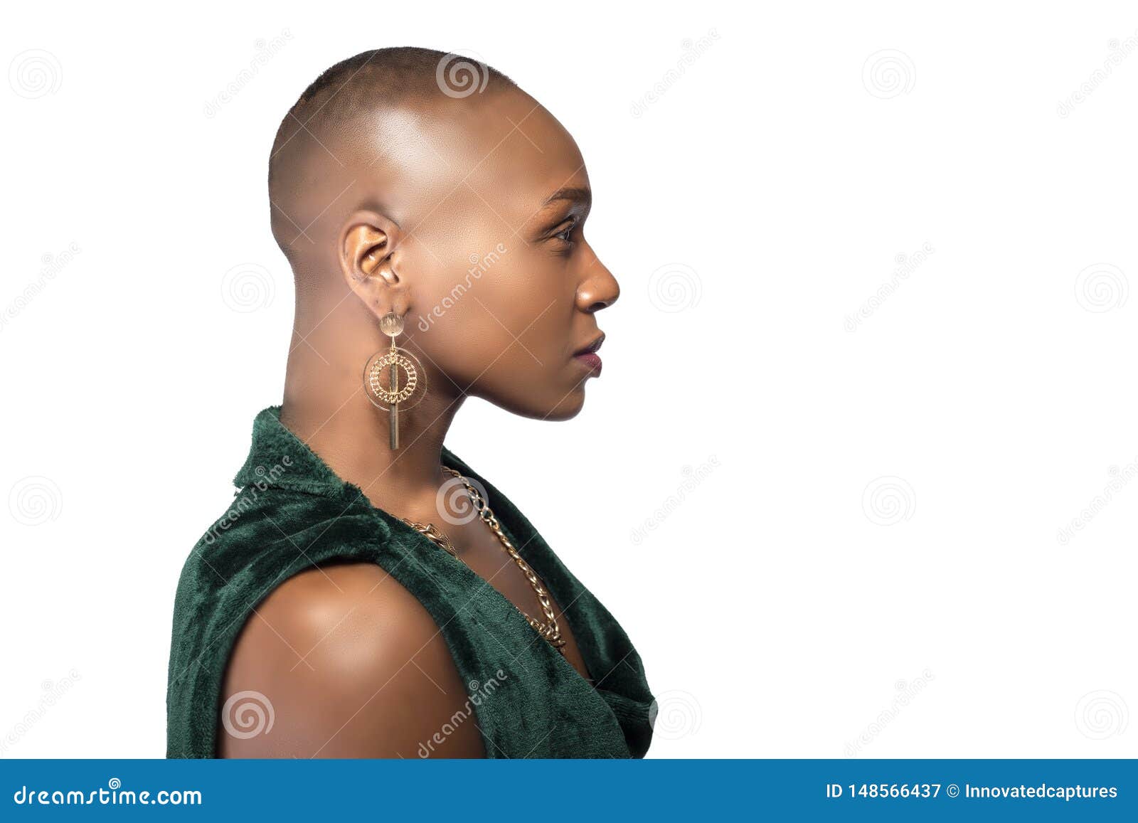Black african american female model with bald hairstyle wearing a pink  shirt on a white background looking happy and smiling Stock Photo - Alamy