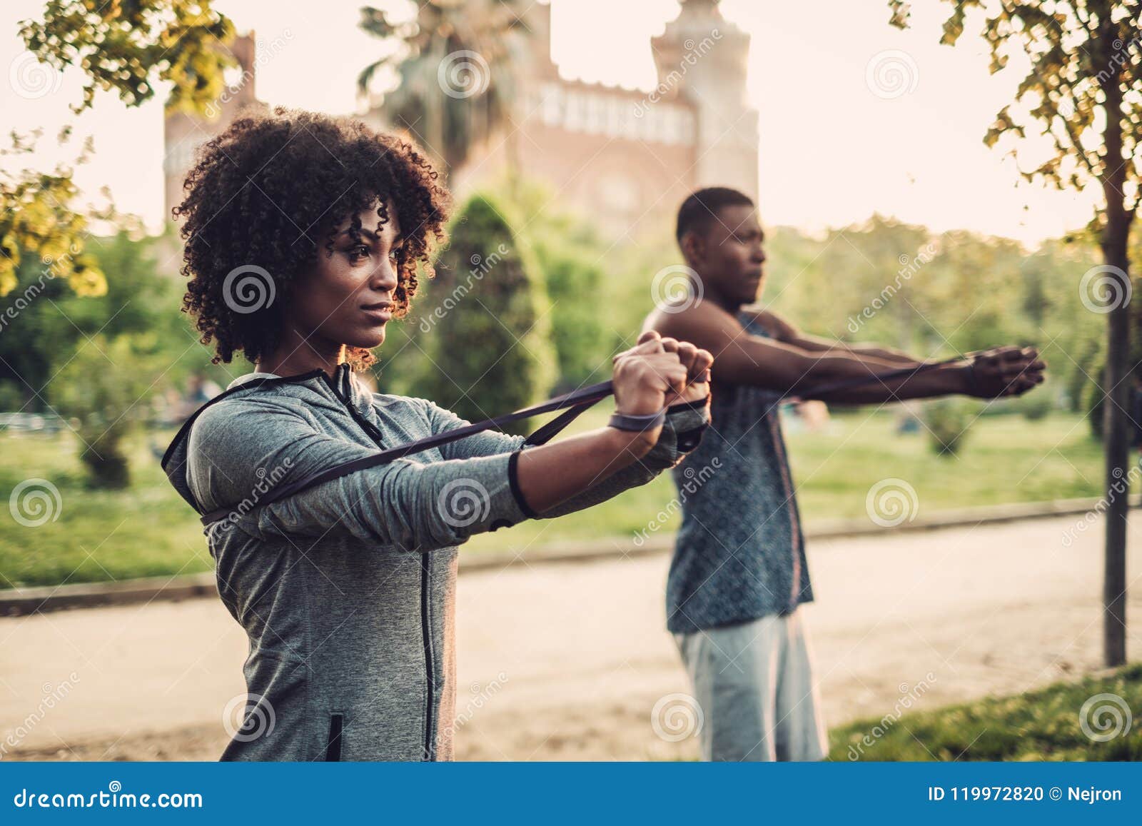 black couple doing exercise outdoors